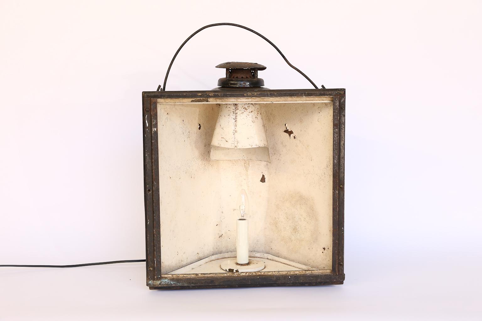 We've converted this antique Adams and Westlake non sweating lantern from Chicago into an electric lamp with new wiring. Adlake is best known as manufacturers of an array of transportation accessories, primarily for the railroads. The steel lantern