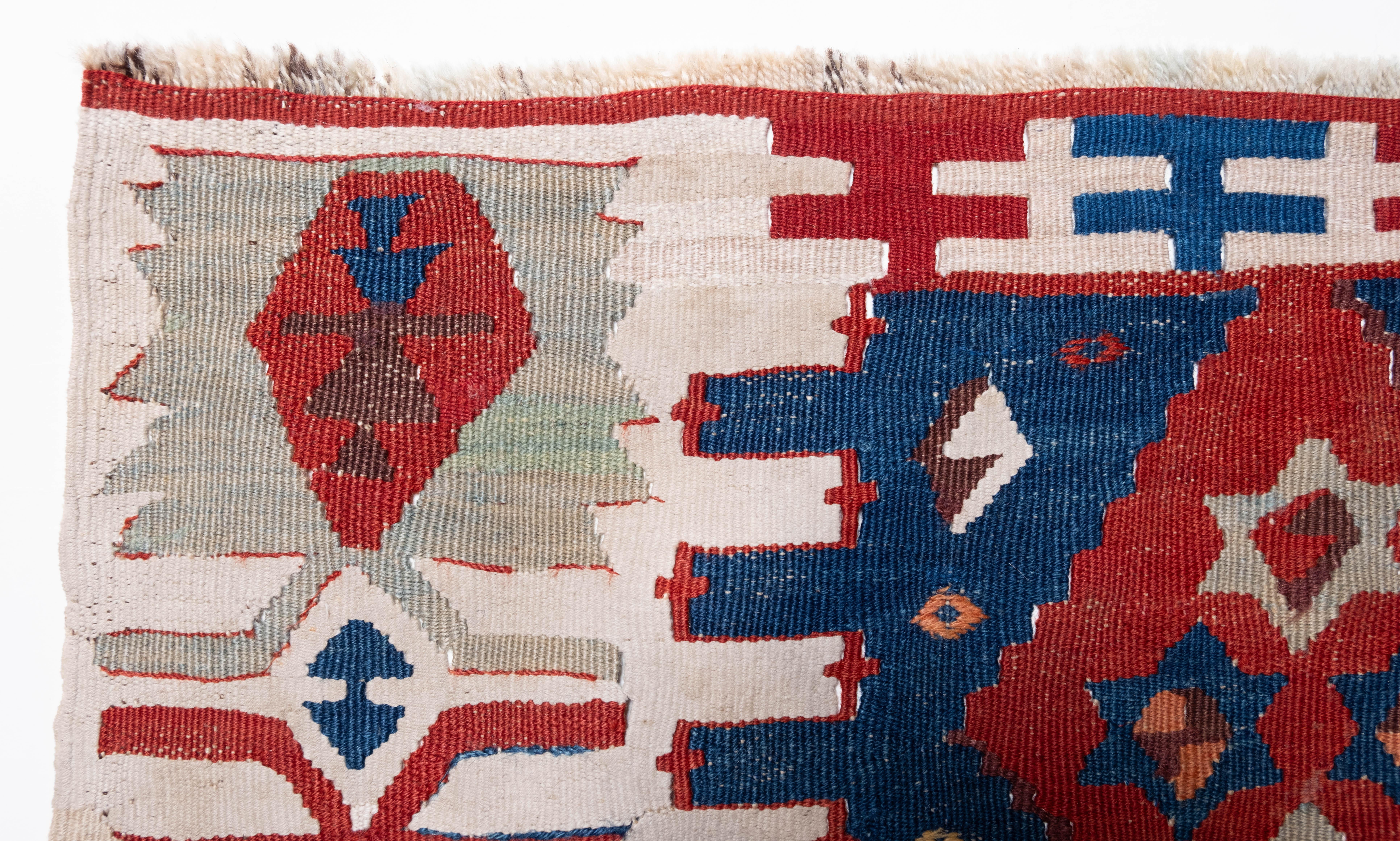 This is Eastern Anatolian Antique Kilim from the Adana region with a rare and beautiful color composition.

This highly collectible antique kilim has wonderful special colors and textures that are typical of an old kilim in good condition. It is a
