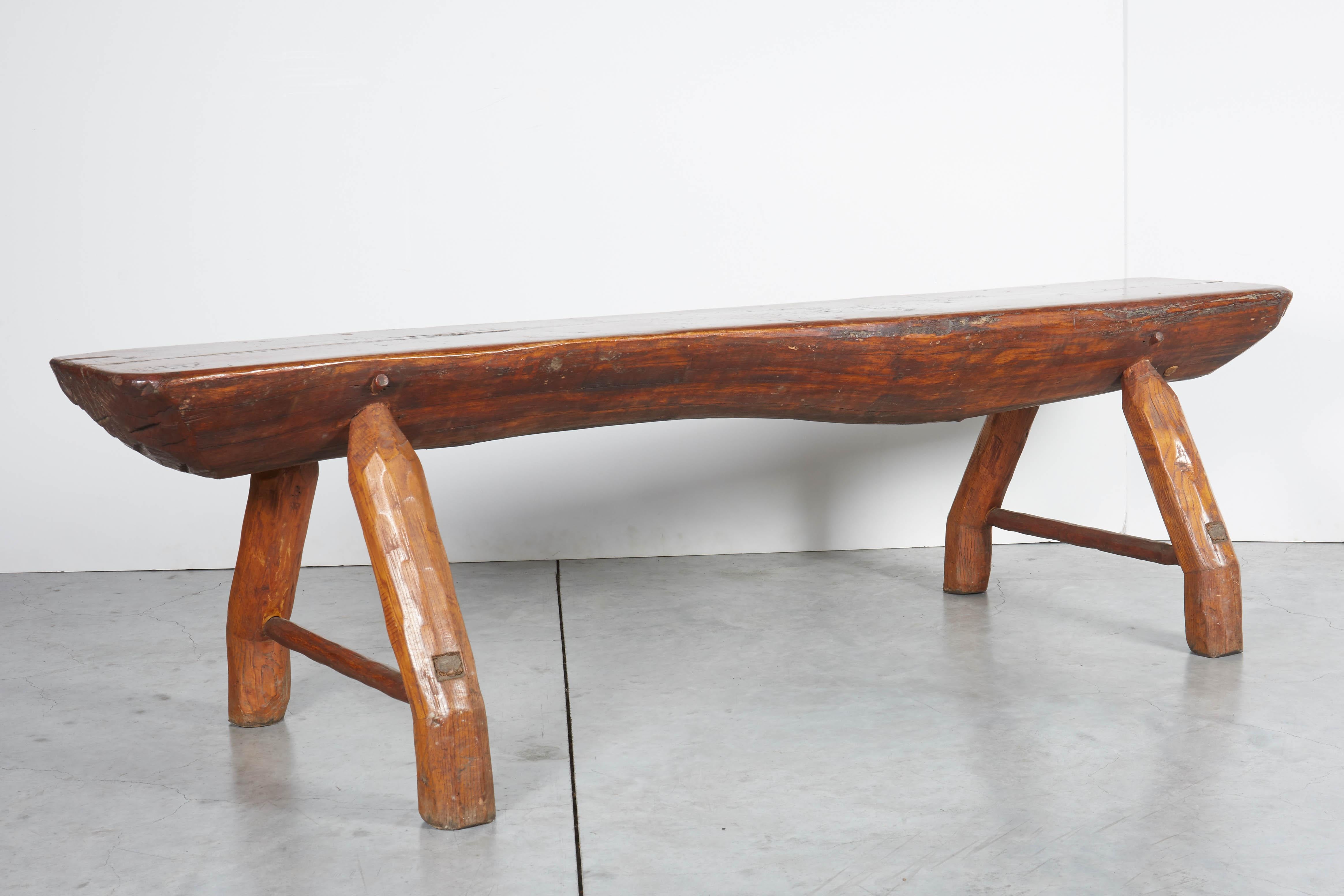 20th Century Antique Adirondack Bench with Very Thick Seat and Striking  Hand Hewn Legs For Sale