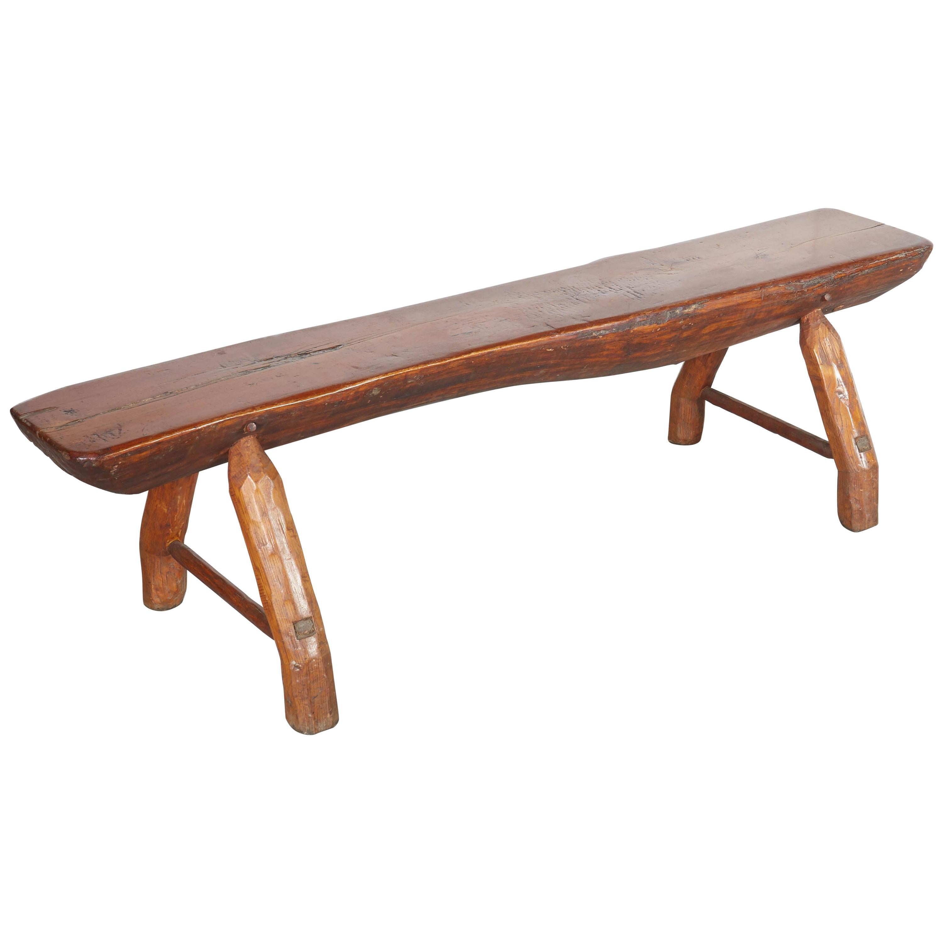 Antique Adirondack Bench with Very Thick Seat and Striking  Hand Hewn Legs For Sale