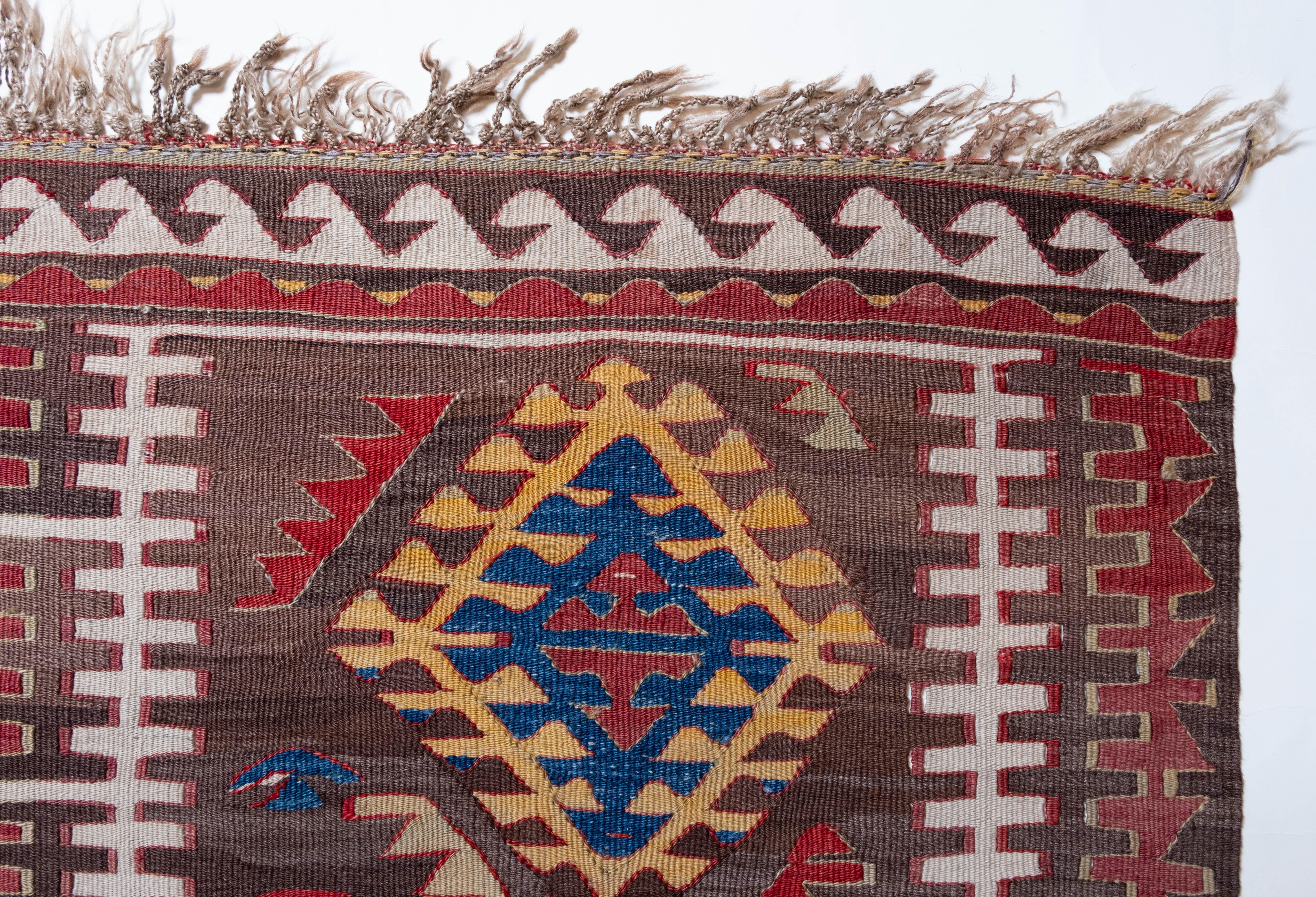 This is Eastern Anatolian Antique Kilim from the Adiyaman region with a rare and beautiful color composition.

This highly collectible antique kilim has wonderful special colors and textures that are typical of an old kilim in good condition. It is