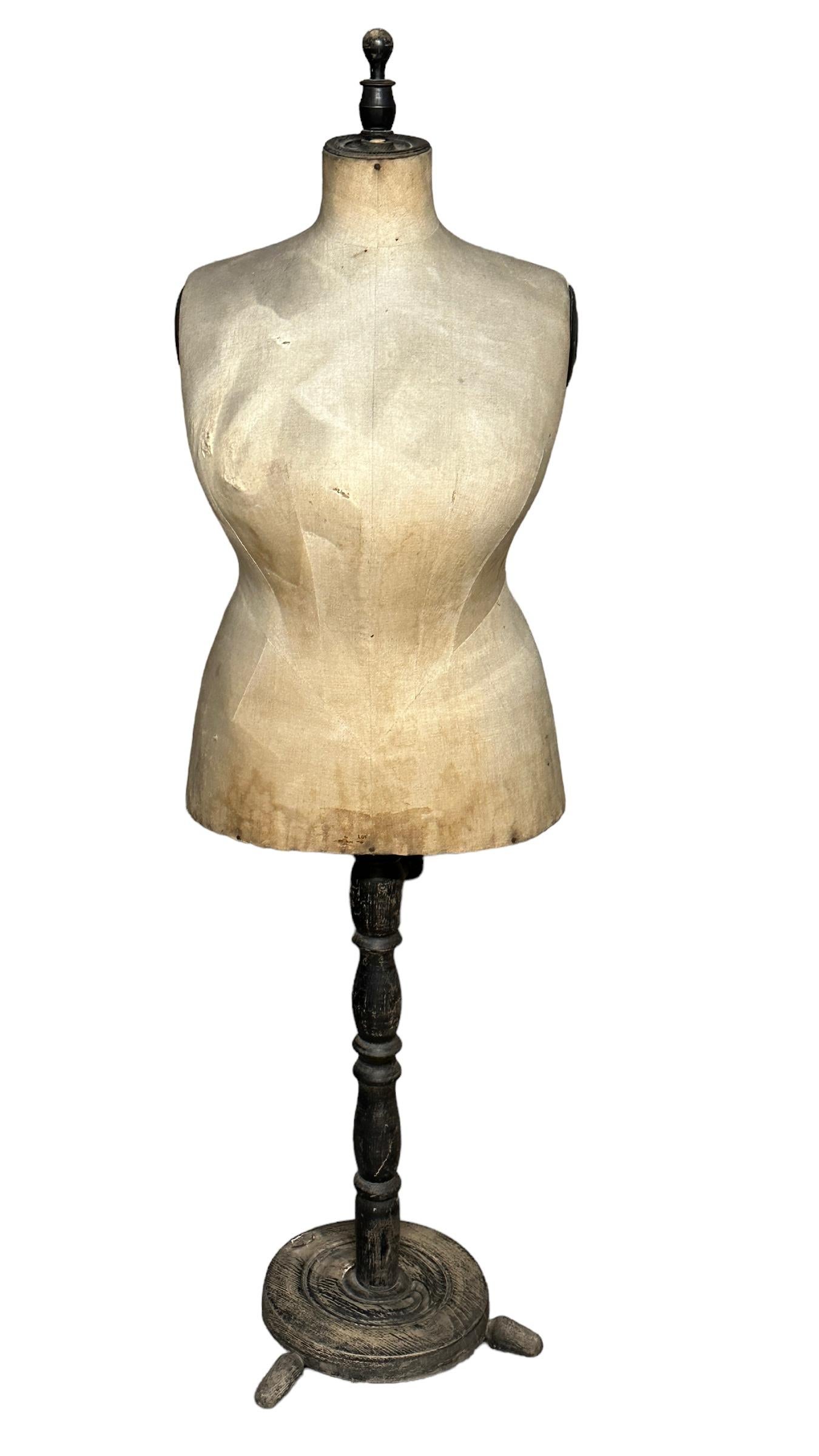 A great looking originally used by Austrian tailors and dressmakers for draping, alterations, and creating the latest fashion, this vintage dressmaker mannequin is also a great piece of decor. This adjustable height dress form has ebonized and