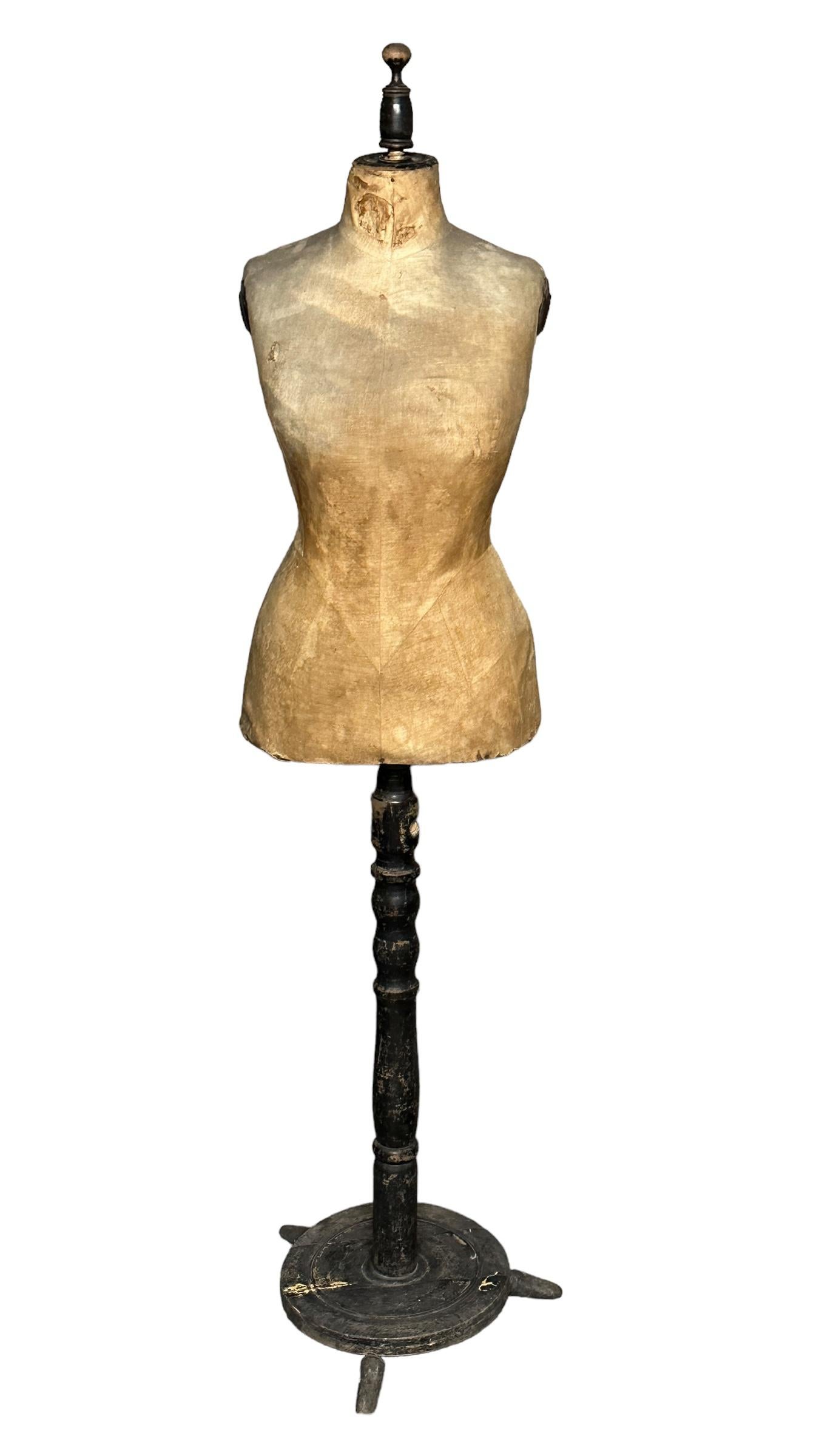A great looking originally used by Austrian tailors and dressmakers for draping, alterations, and creating the latest fashion, this vintage dressmaker mannequin is also a great piece of decor. This adjustable height dress form has ebonized and