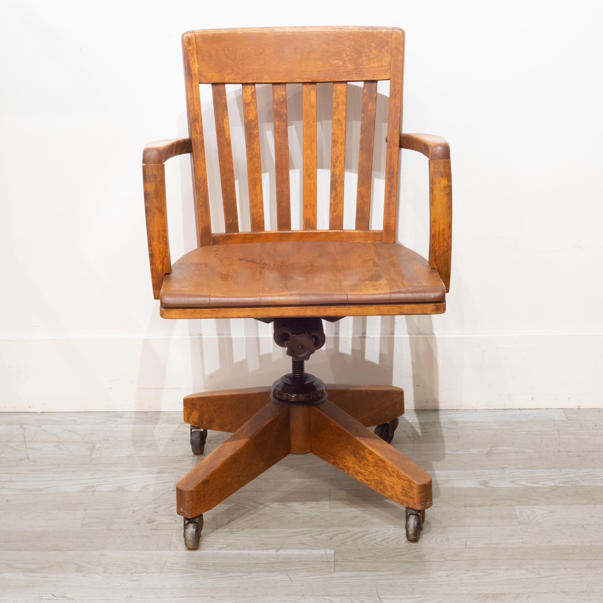 About

This is an original adjustable solid oak desk chair with brass casters and cast iron mechanism. This chair swivels, tilts back and the height is adjustable. This chair has retained its original finish and has minor structural