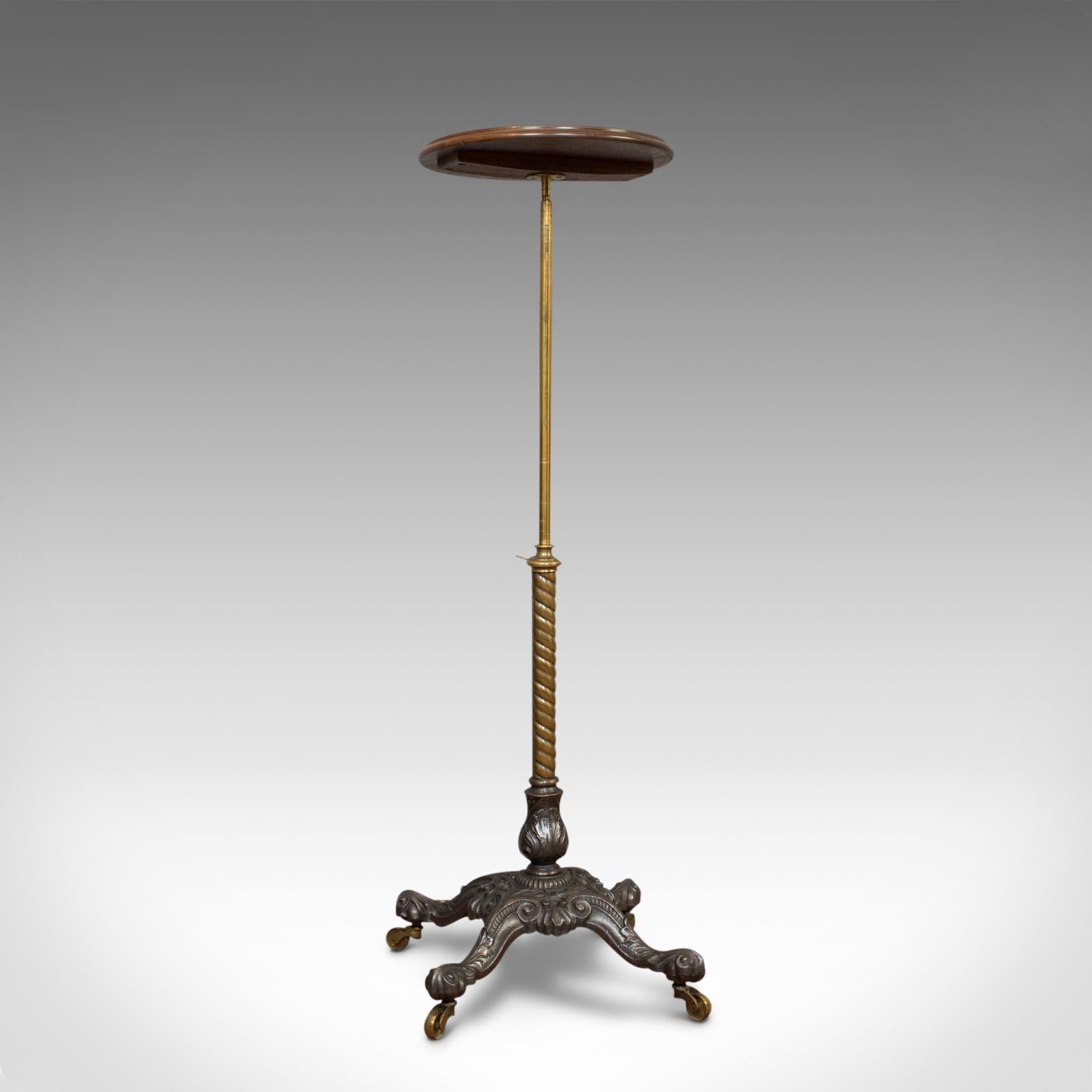 This is an antique adjustable wine table. An English, mahogany and cast iron plant stand or jardiniere and dating to the Victorian period, circa 1860.

Generously adjustable and of pleasing form
Mahogany and cast iron displays a desirable aged