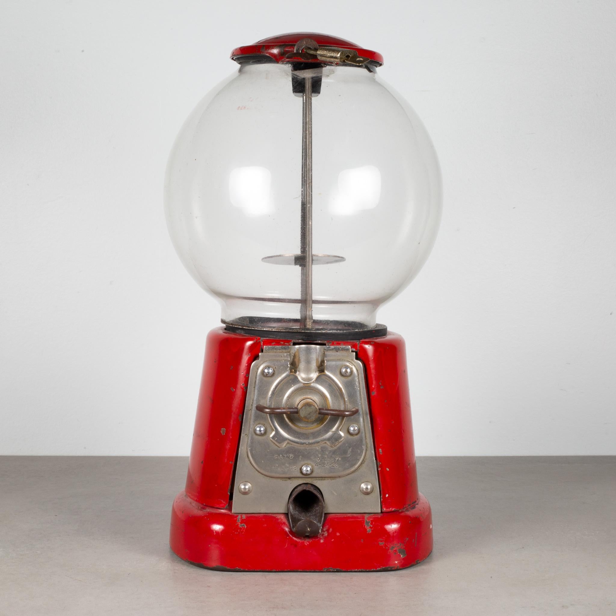ABOUT

An antique cast iron 1 cent gum ball machine with hand blown glass globe. Original patent dates stamped on front. Works properly. 

 CREATOR Advanced Machine Co.
 DATE OF MANUFACTURE c.1920.
 MATERIALS AND TECHNIQUES Cast Iron, Metal, Chrome.