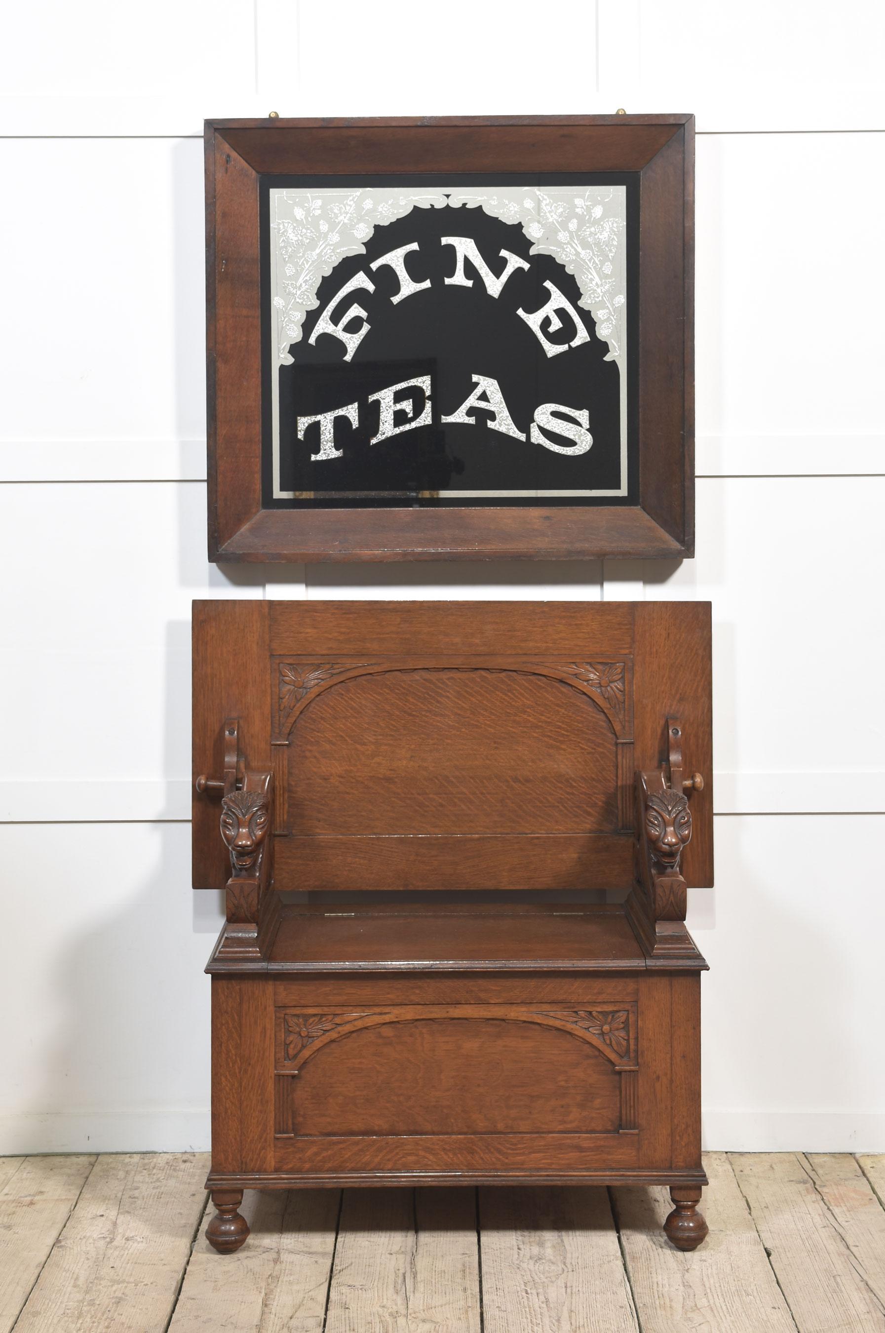 Oak framed advertising mirror encased in oak frame, inscribed Fine Teas on a black background decorated with floral relief.
Dimensions
Height 30.5 Inches
Width 34 Inches
Depth 3 Inches