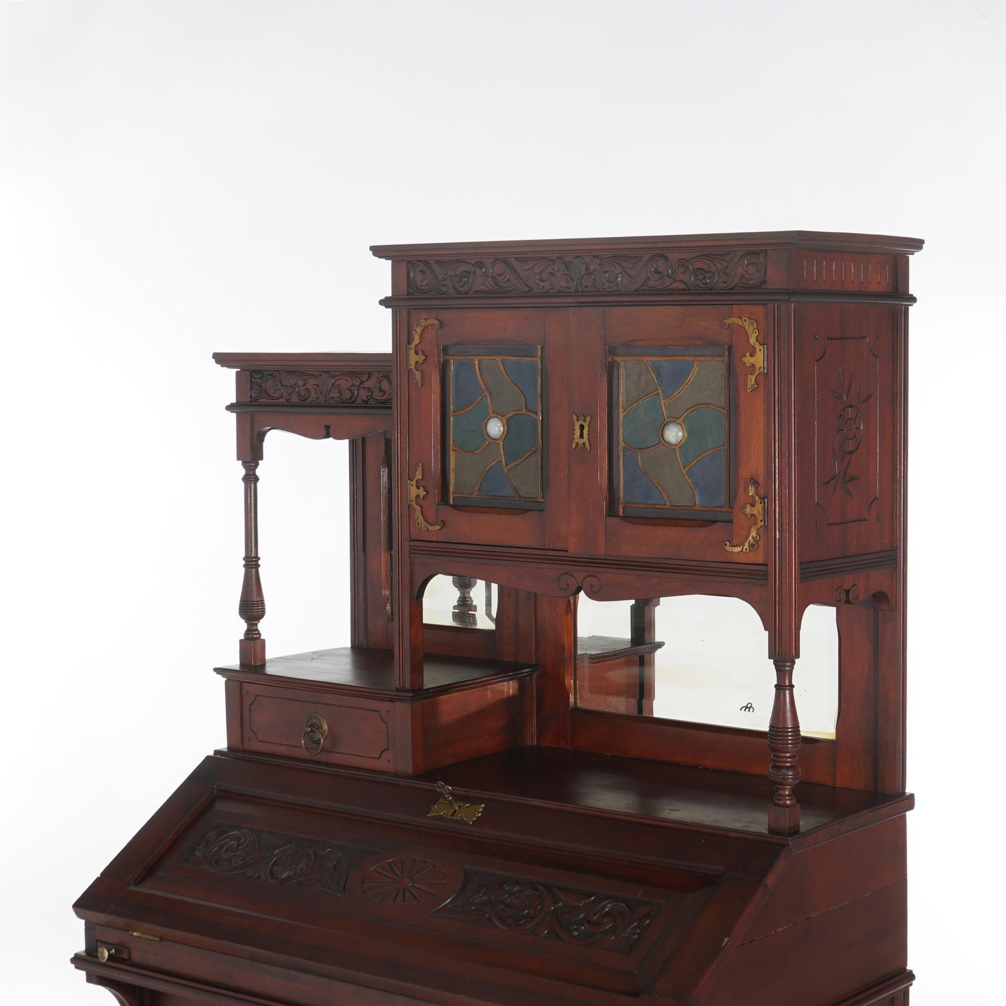 ***Reduced Delivery Rates - See Below or Click “Ask The Seller” to Request a Quote***

Antique Aesthetic Mahogany Drop Front Lady’s Desk with Jeweled Stained Glass Cabinet, Mirrored back, and rope twist columns, c1880

Measures - 57