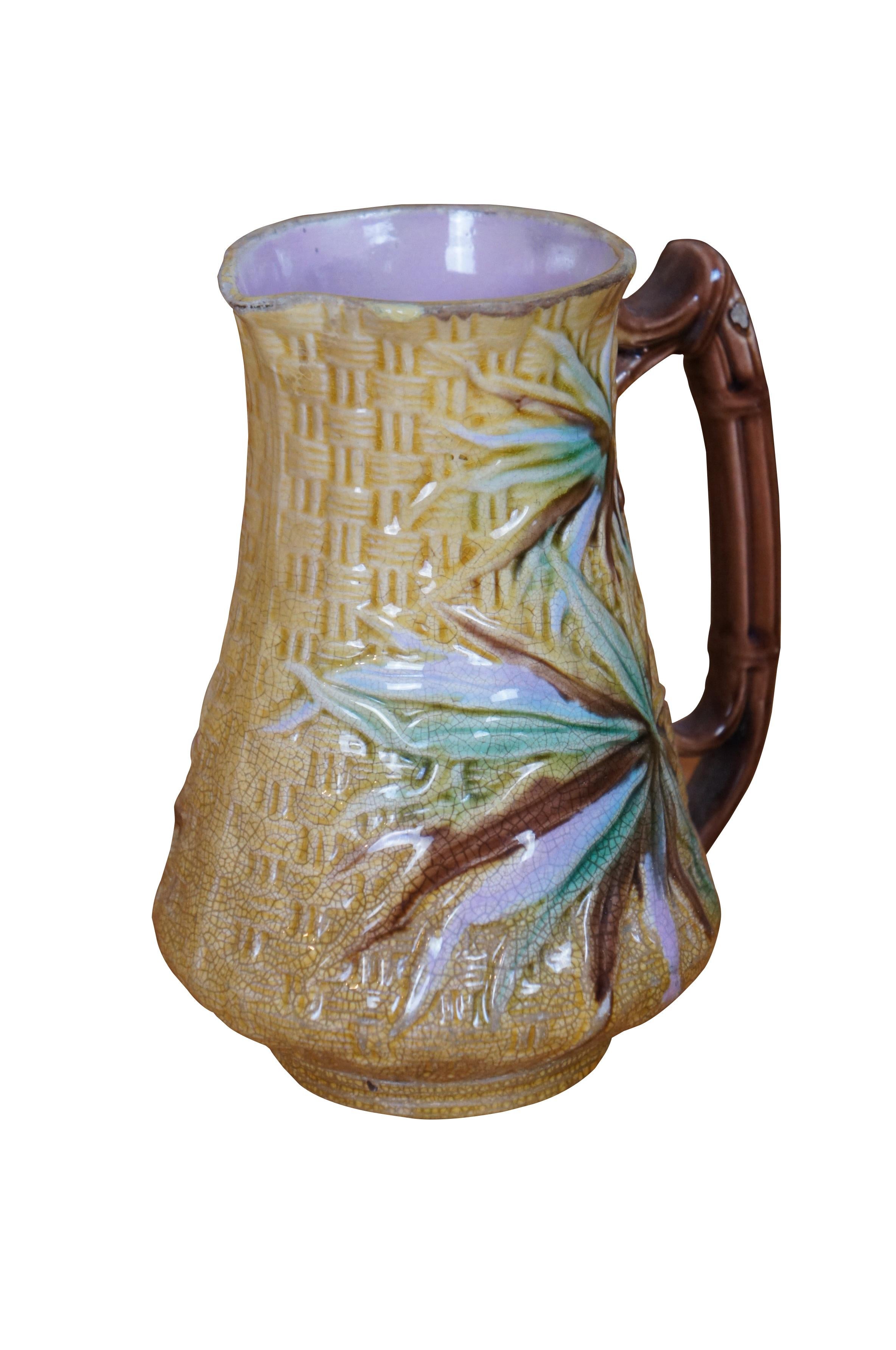 Antique Majolica Banks & Thorley pitcher / jug featuring a golden basketweave pattern with floral bamboo fronds.  Illegible British Registry mark on base, but circa 1880s.

Banks & Thorley Bamboo
Banks and Thorley as a pottery didn't last very