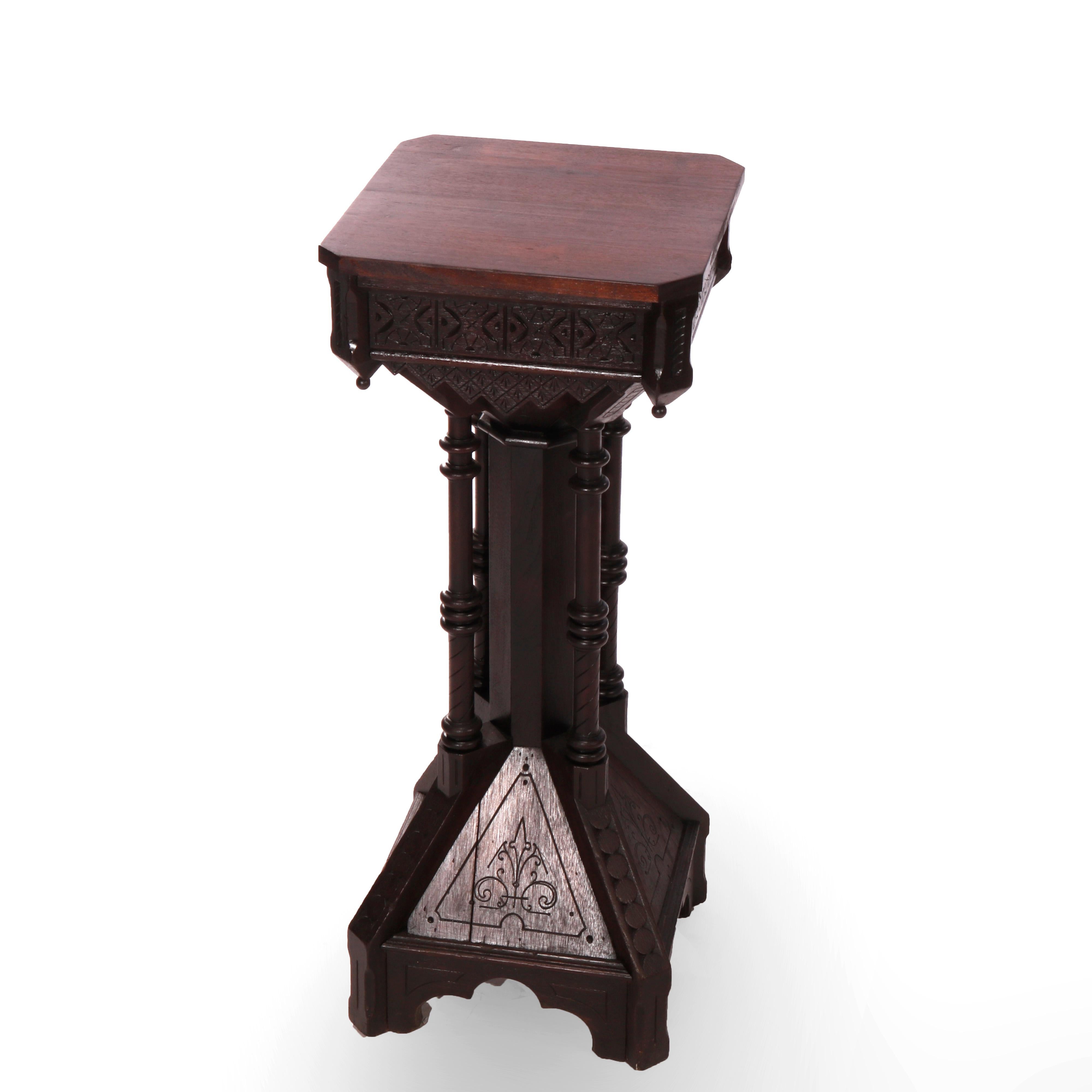 An antique Aesthetic movement sculpture pedestal offers walnut construction with clip corner display over column having four turned supports raised on flared base with incised floral decoration, c1870

Measures - 37.75''H X 15.25''W X 15.25''D.