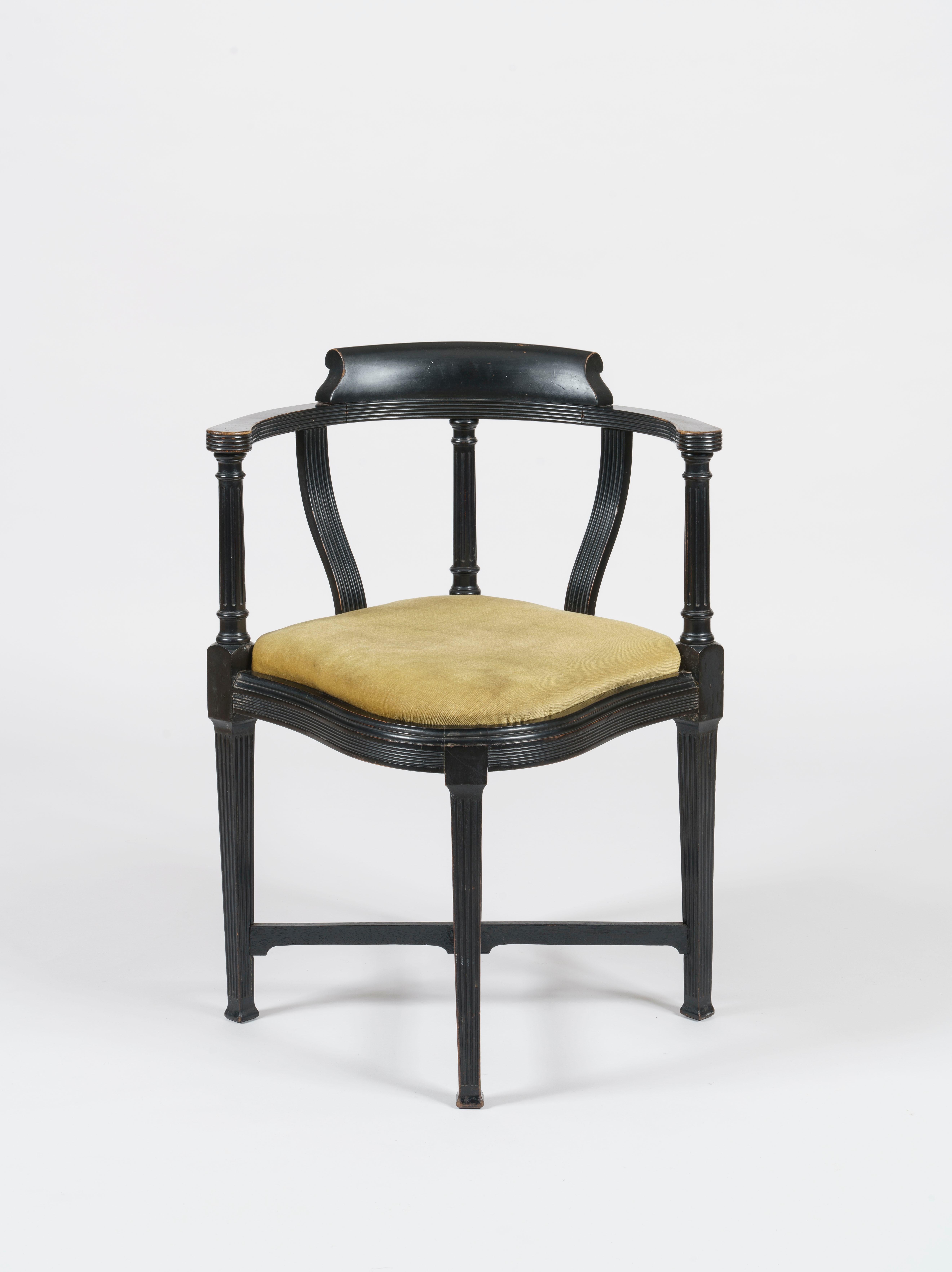 An aesthetic movement chair
By Lamb of Manchester

designed by W.J. Estall

Of unique elegance and design, the black ebonised chair fashioned in the Aesthetic manner featuring carved details along the seat rail, crest rail, and the refined upright
