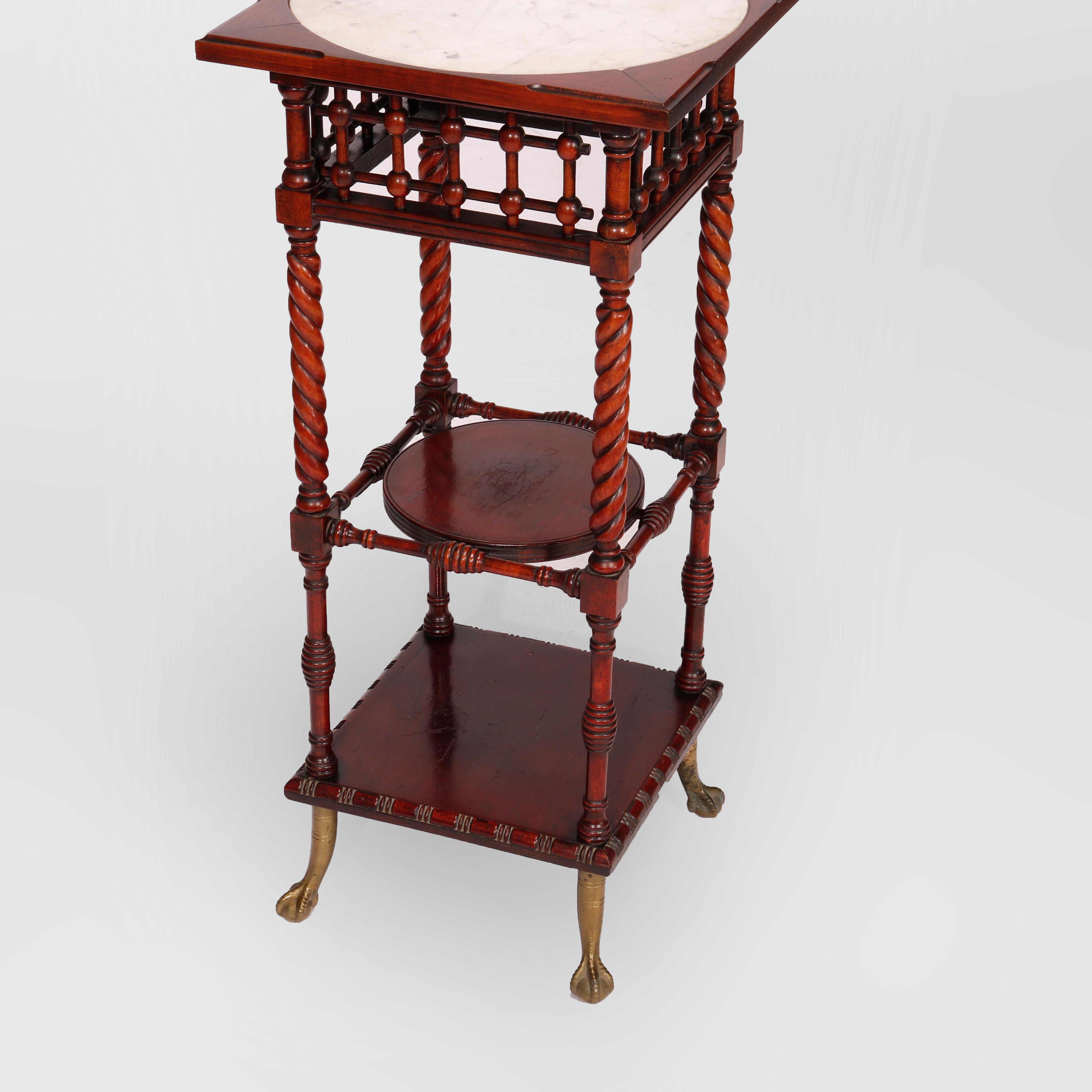 An antique Aesthetic Movement side stand offers mahogany construction with inset marble display with stick and ball skirt over carved rope twist legs having lower display and raised on case claw and ball feet, c1900

Measures - 33.5''H x 15''W x
