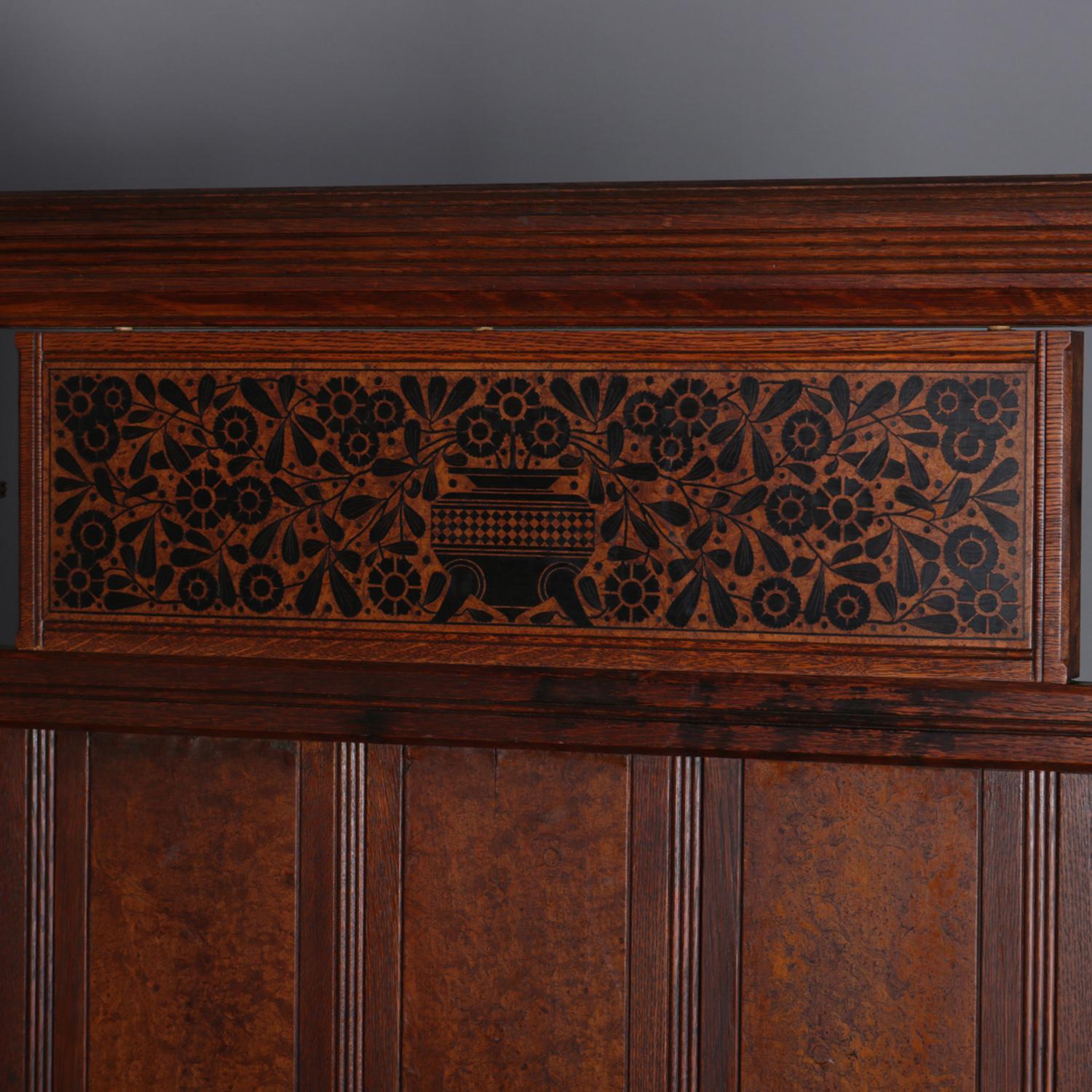 An antique Aesthetic Movement Herter Bros. School 3/4 bed features oak construction with burl panels, and spindle galleries, headboard with mahogany marquetry having stylized central urn and allover floral design, circa 1900

Measures: overall 68