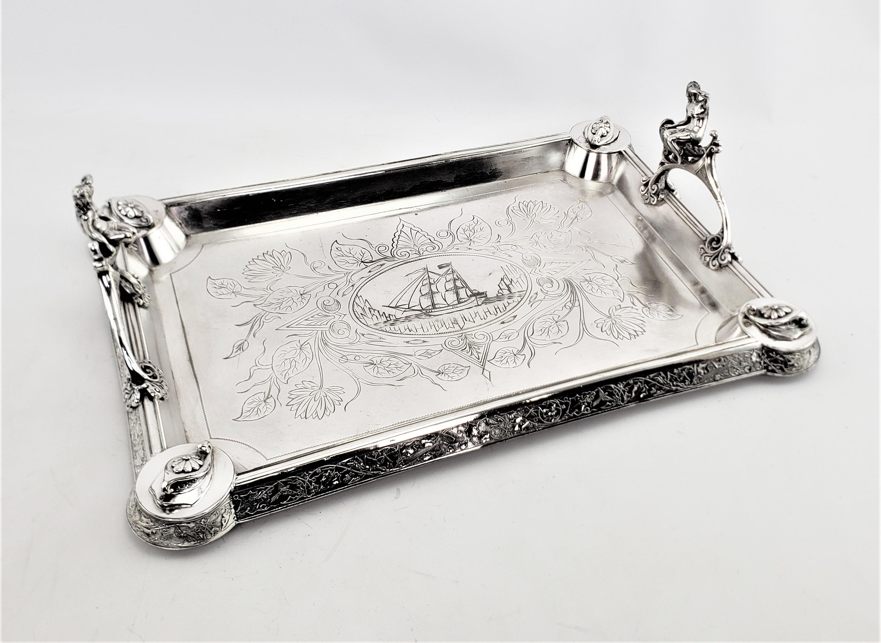 This very elaborate and well executed silver plated serving tray is unsigned, but presumed to have originated from the United States, possibly by Meridian, and dating to approximately 1890 and done in the period Aesthetic Movement style. The tray is