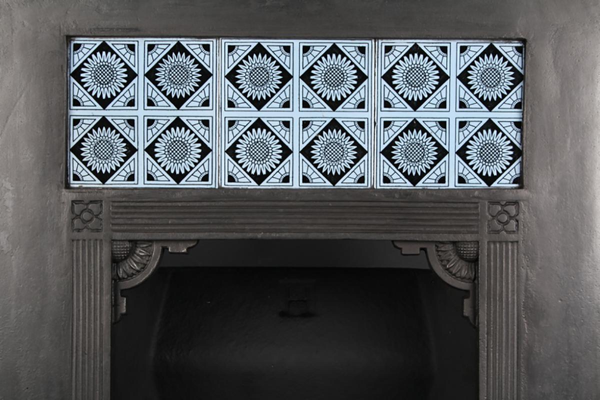 Antique Aesthetic Movement Victorian Minton tiled insert, English, 19th century.

A Small Antique Aesthetic Movement Victorian tiled cast iron fireplace insert, designed by Thomas Jeckyll (1827-1881) for Barnard Bishop & Barnards foundry of