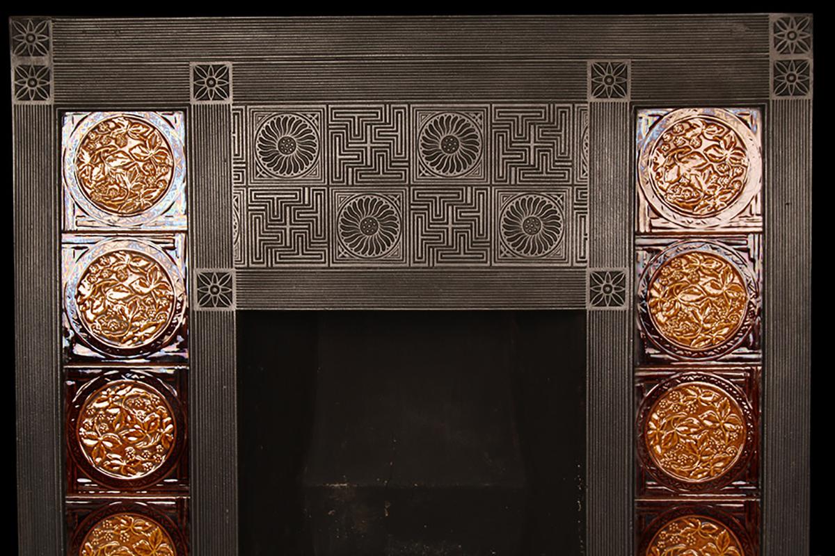 Aesthetic movement Victorian insert
An antique aesthetic movement Victorian tiled cast iron fireplace insert, designed by Thomas Jeckyll (1827-1881) for Barnard Bishop & Barnards foundry of Norwich, complete with its original minton brown and