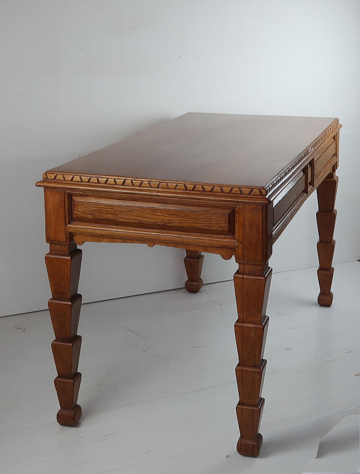 Most unusual library table or desk.

Designer unknown

Beautiful golden oak.

It is freestanding, finished all the way round. No drawers

In aesthetic style. There are elements of Egyptian revival and even Aztec.

Measure: 23 inch leg
