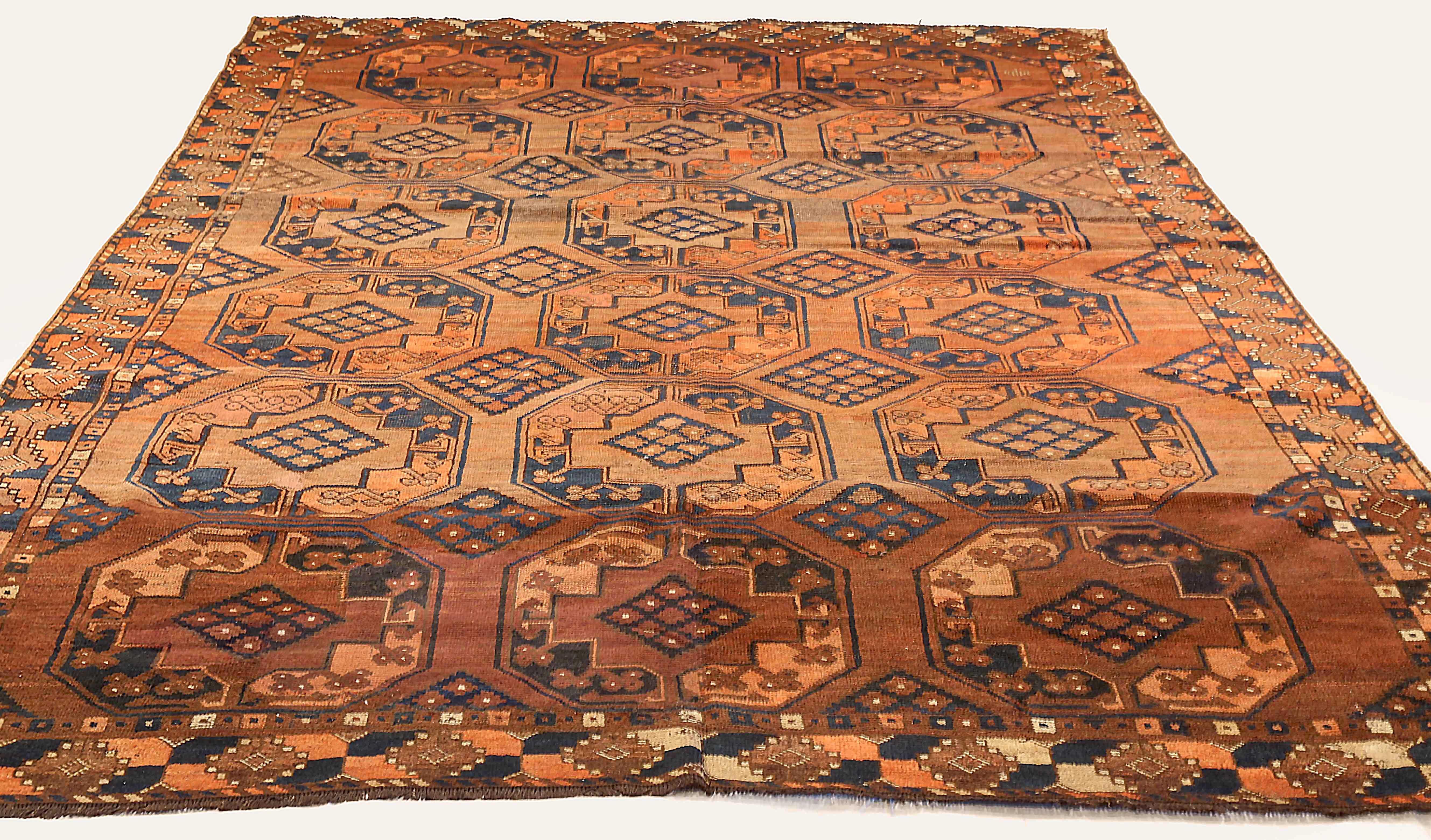 Antique Afghan area rug handwoven from the finest sheep’s wool. It’s colored with all-natural vegetable dyes that are safe for humans and pets. It’s a traditional Tekeh design handwoven by expert artisans.It’s a lovely area rug that can be