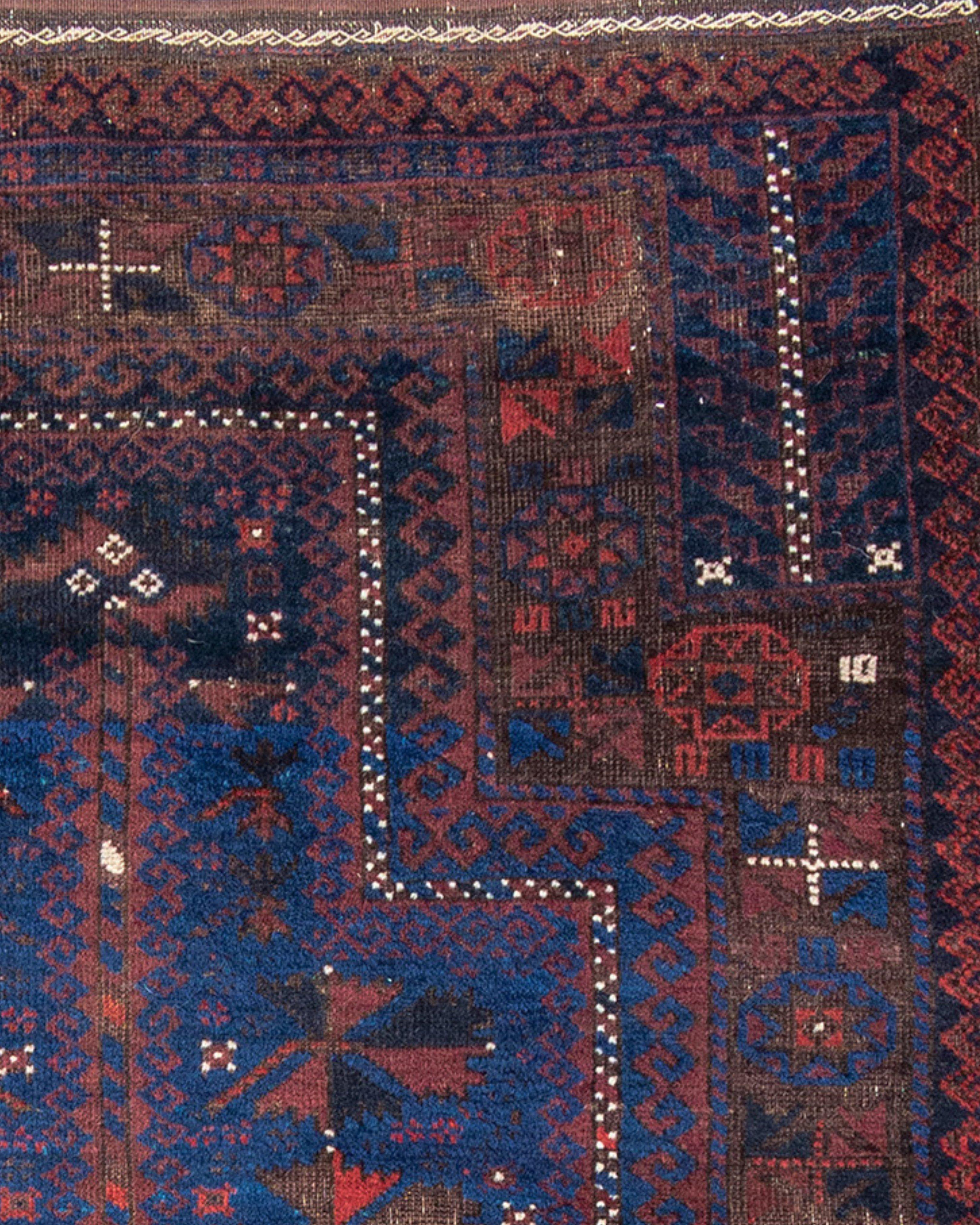 Antique Afghan Baluch Prayer Rug, Late 19th Century

A spaciously drawn blue ground prayer rug, possibly from northeast Persia. The complex primary border suggests the provenance; as such drawing is rarely (if ever?) seen in examples from the Afghan