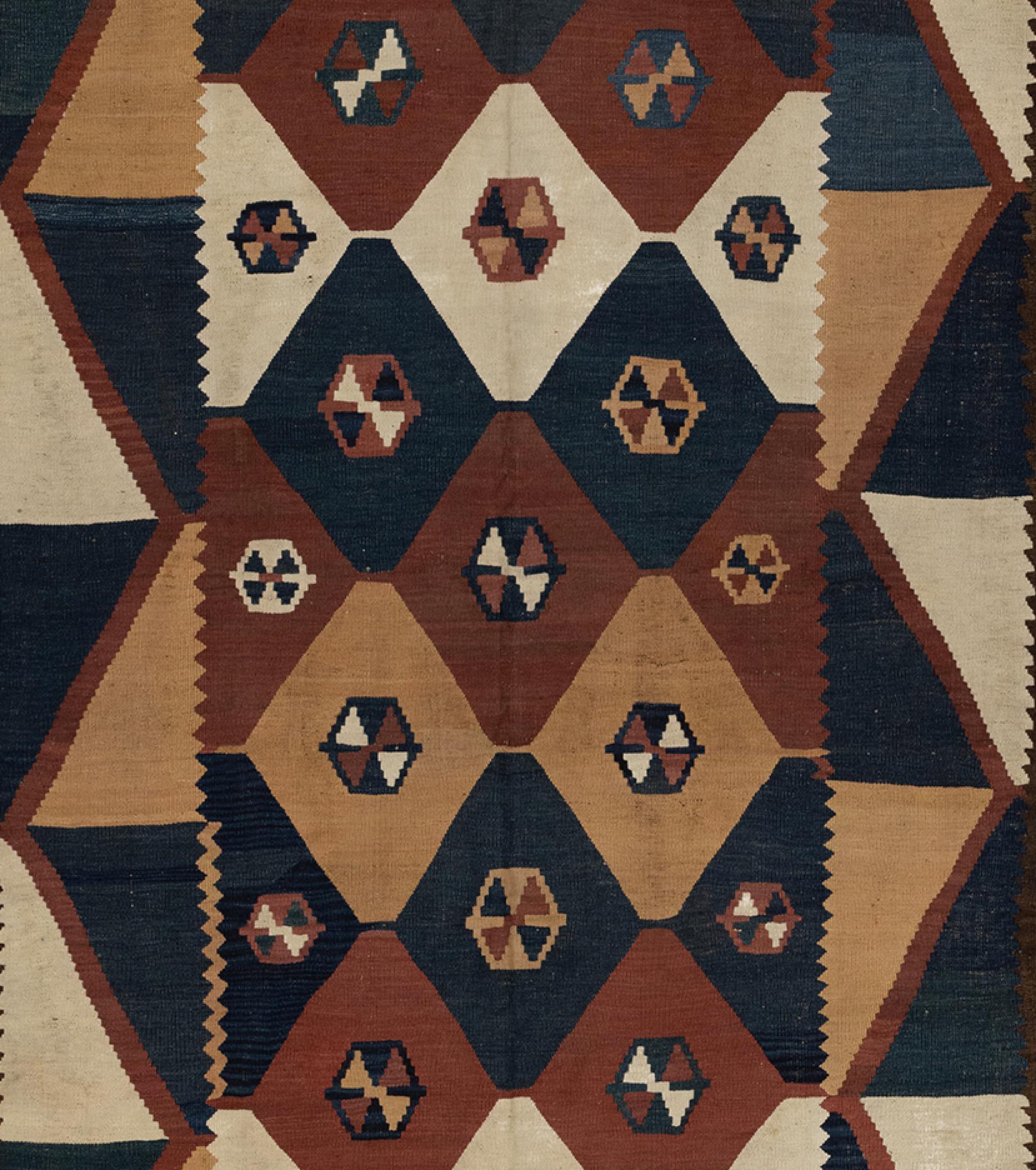 This is an antique Afghan Maymana Kilim from Bamyan area of Afghanistan, circa 1900s. The colors are made with natural vegetable dyes in beautiful indigo blues, yellows, browns and ivory and rust. Featuring geometric nomadic design on a large-scale.