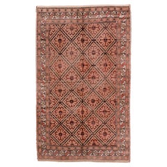 Tappeto afgano antico con motivo a rombi su tutta la superficie, nei delicati toni del terracotta e del marrone
