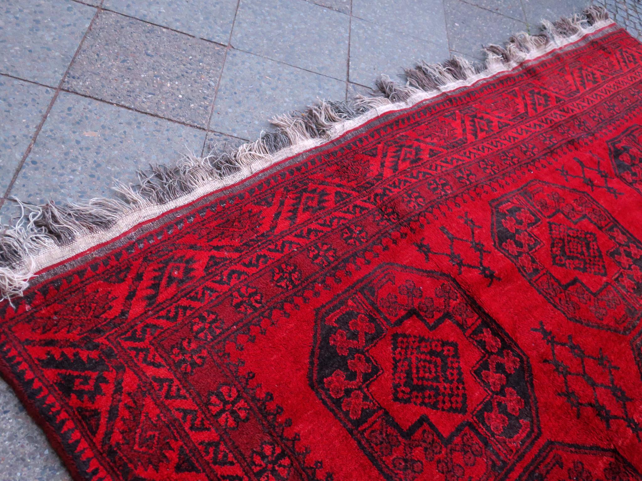 Hand-Knotted Antique Afghan Rug Rich Red Background, 1920 For Sale