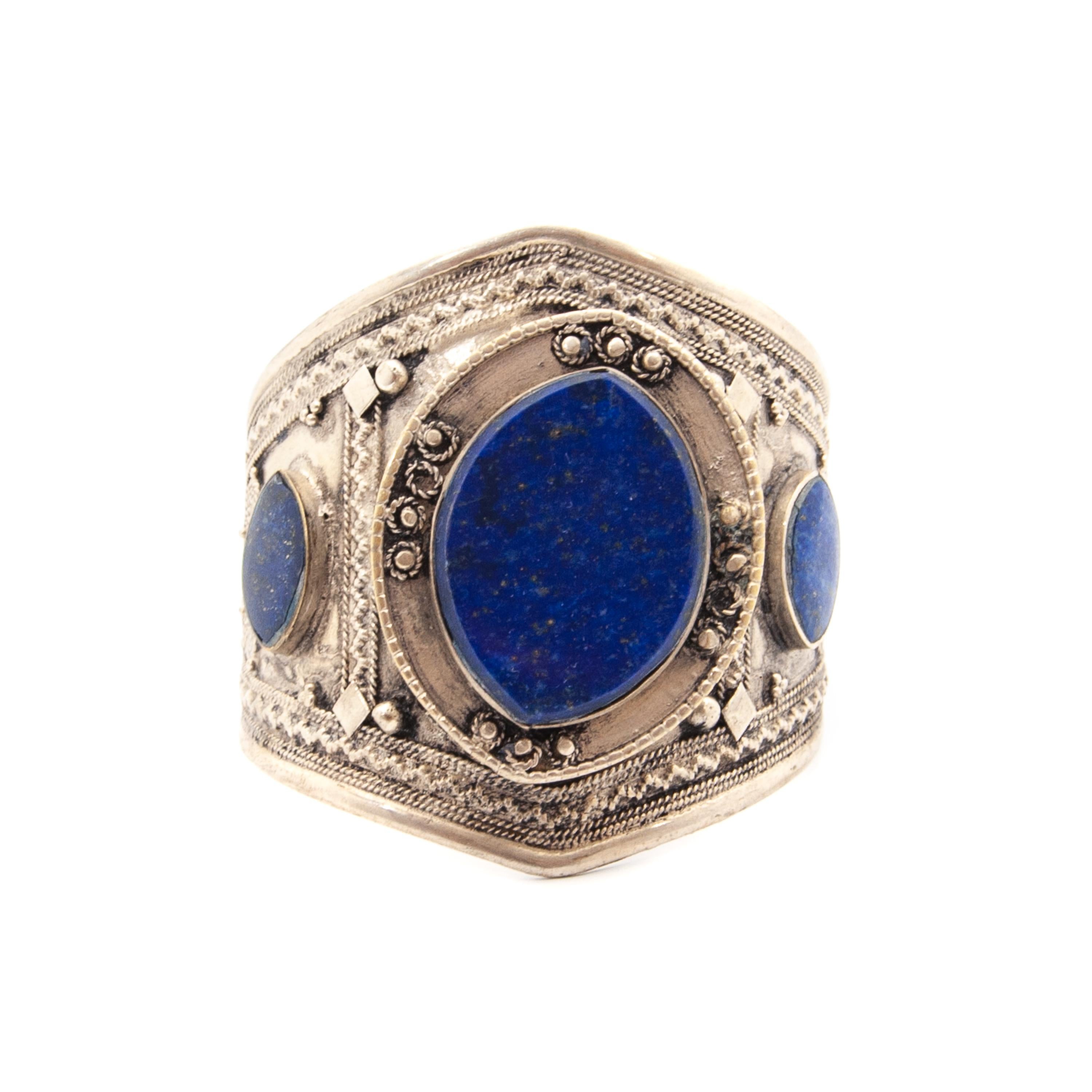 A beautiful mid-century lapis lazuli silver tribal bracelet. This type of bracelet is supposed to be a Turkmen or Pashtun tribes wedding cuff bracelet. The three lapis lazuli stones in rich blue color are set in this hand polished and beautifully