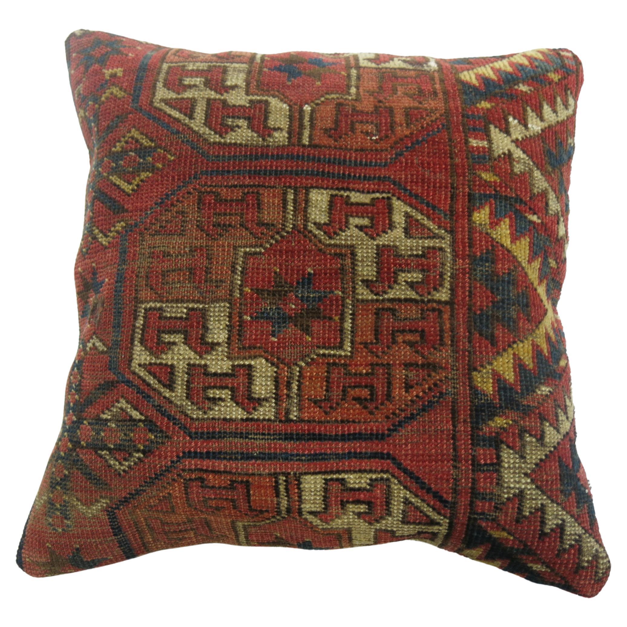 Pillow made from a 19th century afghan Turkeman rug.

Measures: 16'' x 16''.