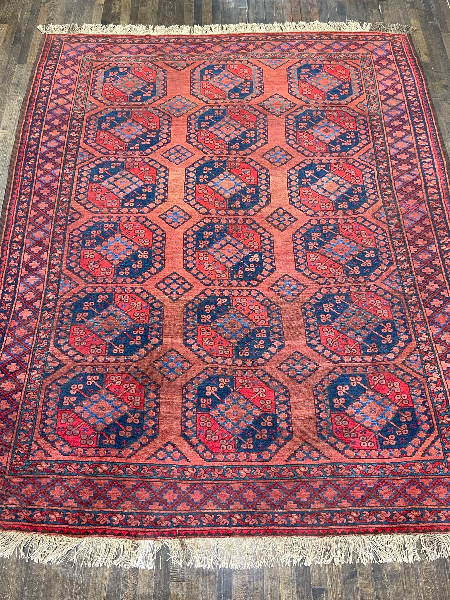This rug is hand woven in Afghanistan. Known as Ersari these Turkaman woven rugs dates back many centuries.Ersari rugs were made with a lustrous wool that could absorb vegetable dyes superbly. The guls on the well-preserved Ersari carpets are known