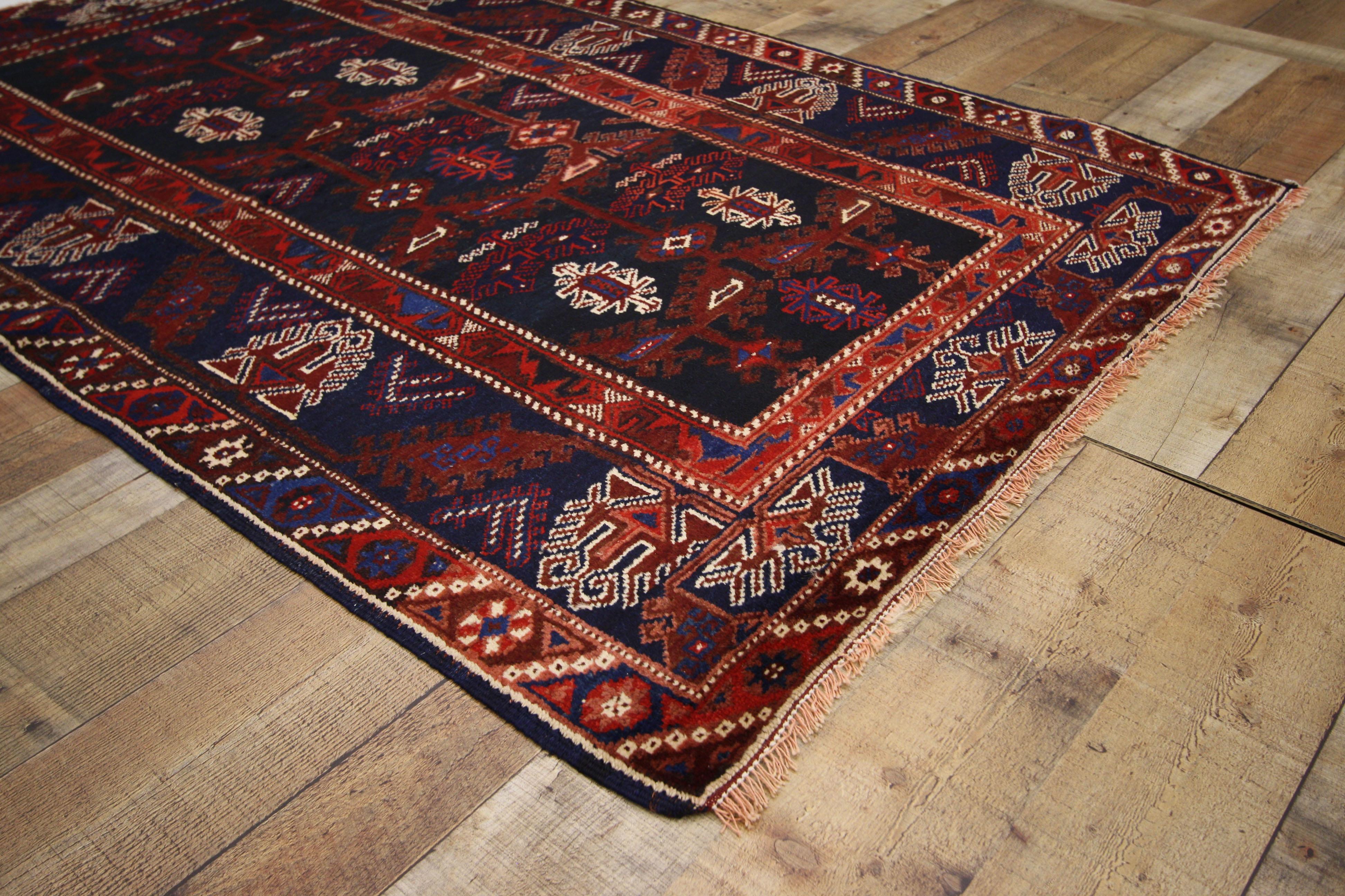 74647, antique Afghani tribal rug or kitchen, bath, foyer or entryway. This hand-knotted wool antique Afghani tribal rug features a geometric pattern in a saturated color palette. Immersed in Afghani history and elements of contrast, this antique