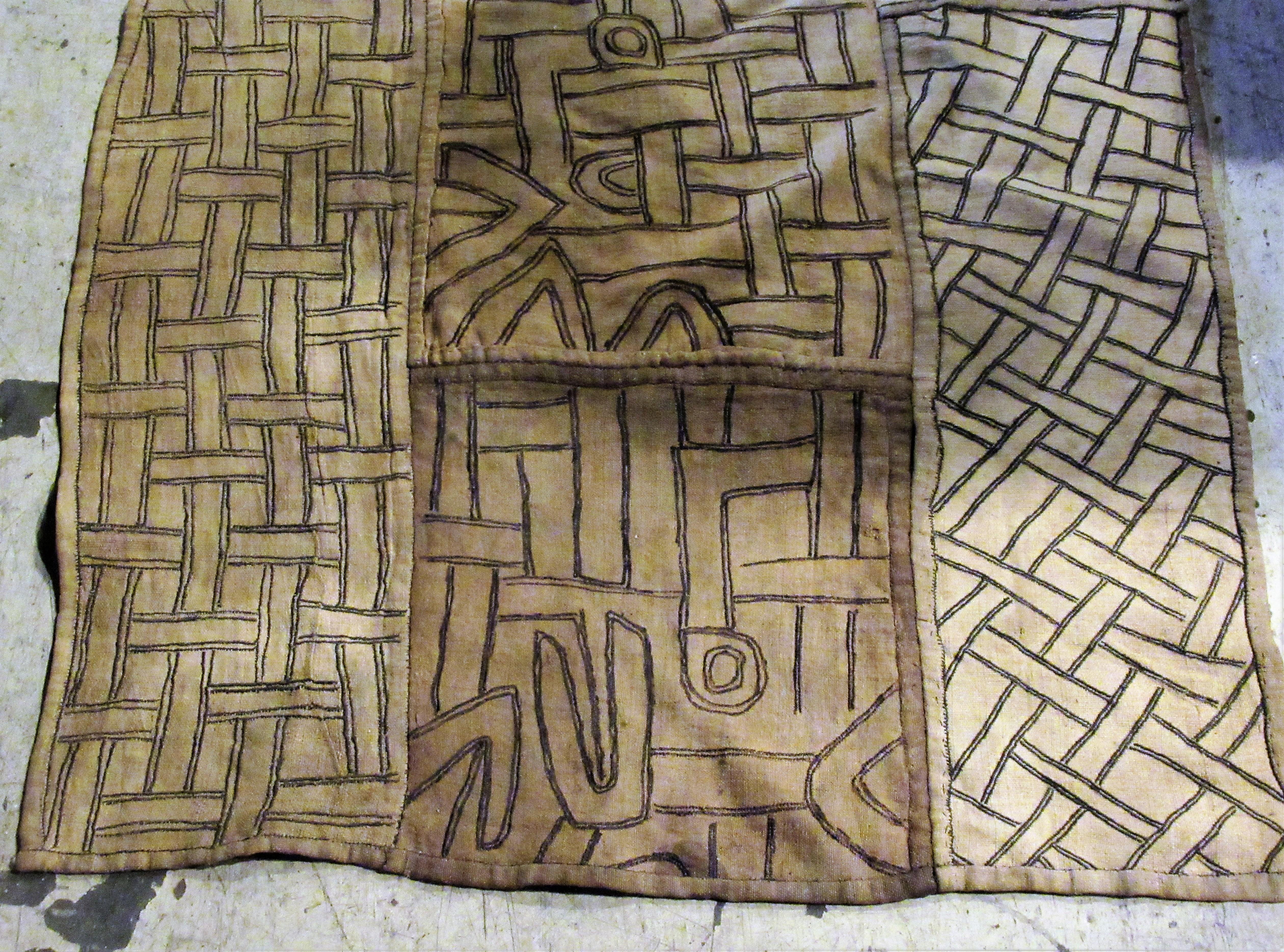 Tribal African Kuba cloth from the congo of handstitched raffia with beautiful naturally aged pale and great graphic design. This is a good old one. We think this dates from the late 19th century to the earlier part of the 20th century. Measures: