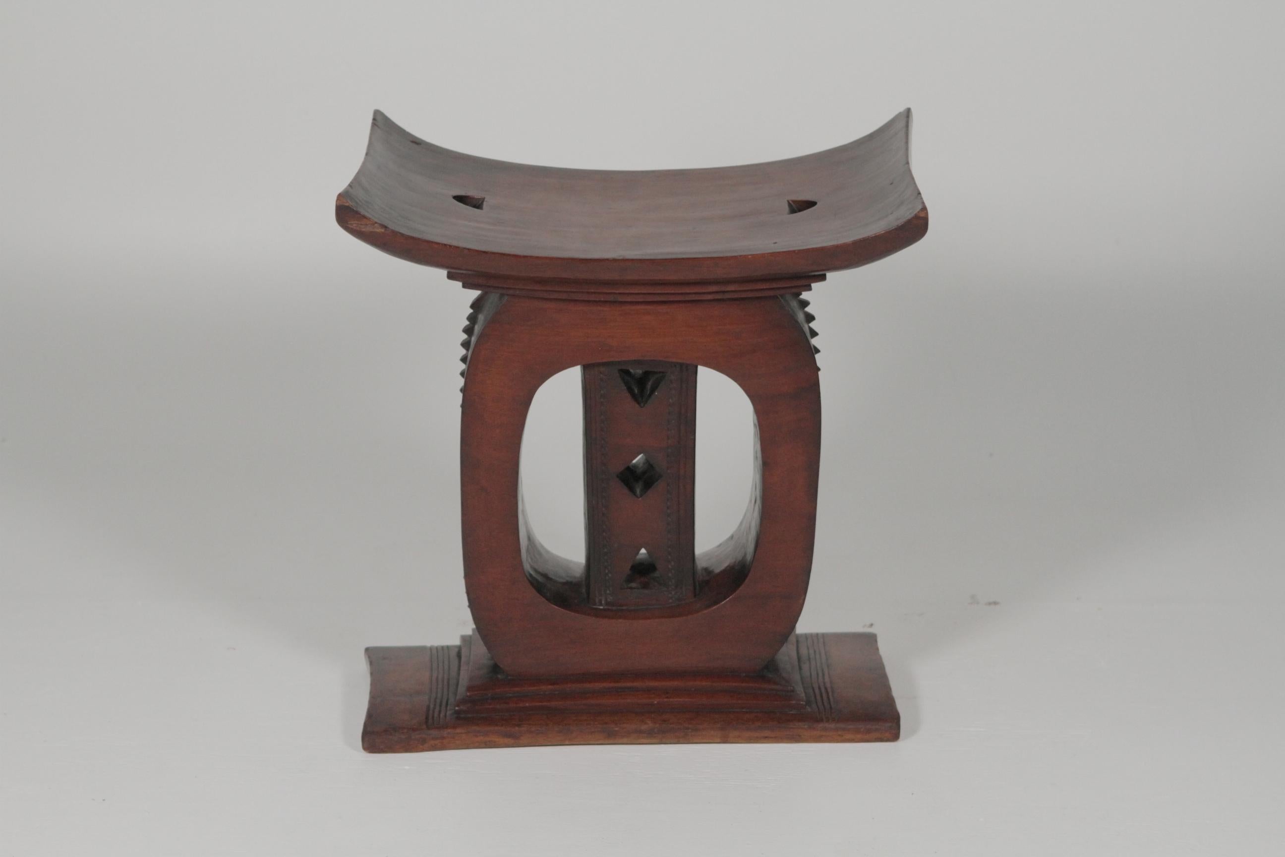 African Ashanti queens royalty bench. The throne seat is carved from one piece of wood with its original patination to the finish. Extraordinary style and craftsmanship.