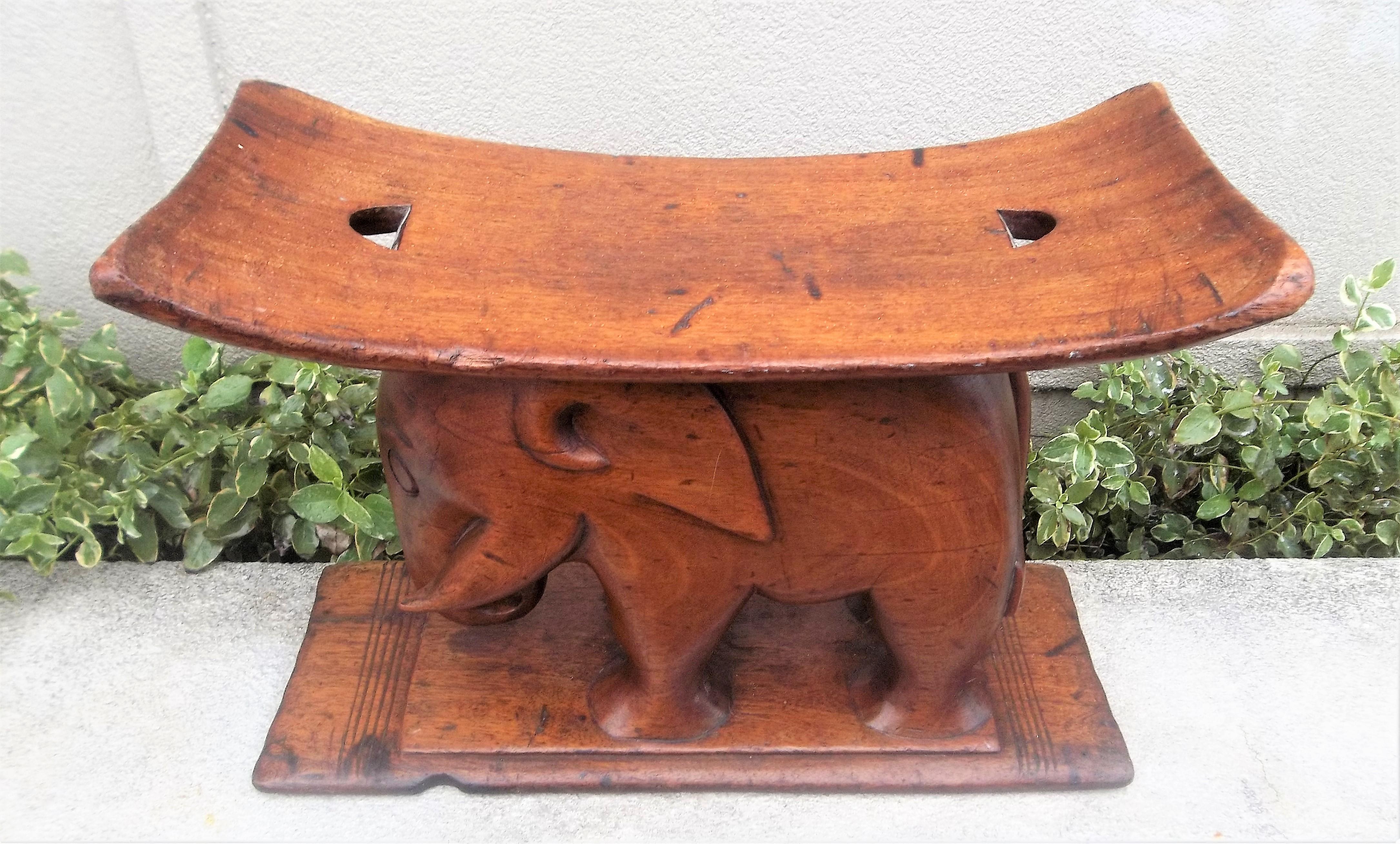 These were dual purpose as stool by day and pillow by night (the pillow cushion strapped thru the openings on top). 
Nice color and patina .No missing parts , tail, trunk and tusks all present and intact , probably Ashanti 

For the Sportsman ,