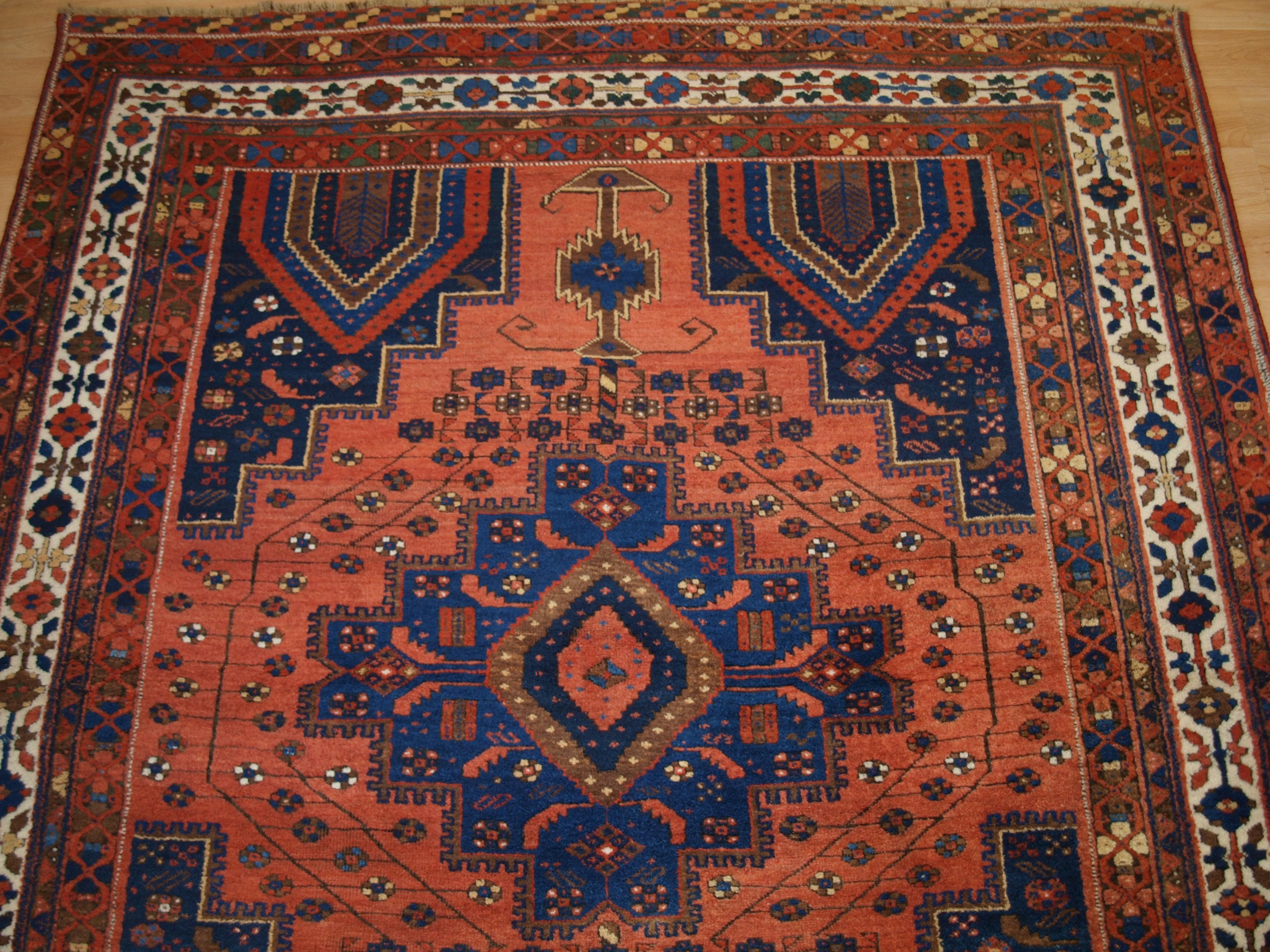 Wool Antique Afshar Neriz Rug with Vase Design and Floral Spray For Sale