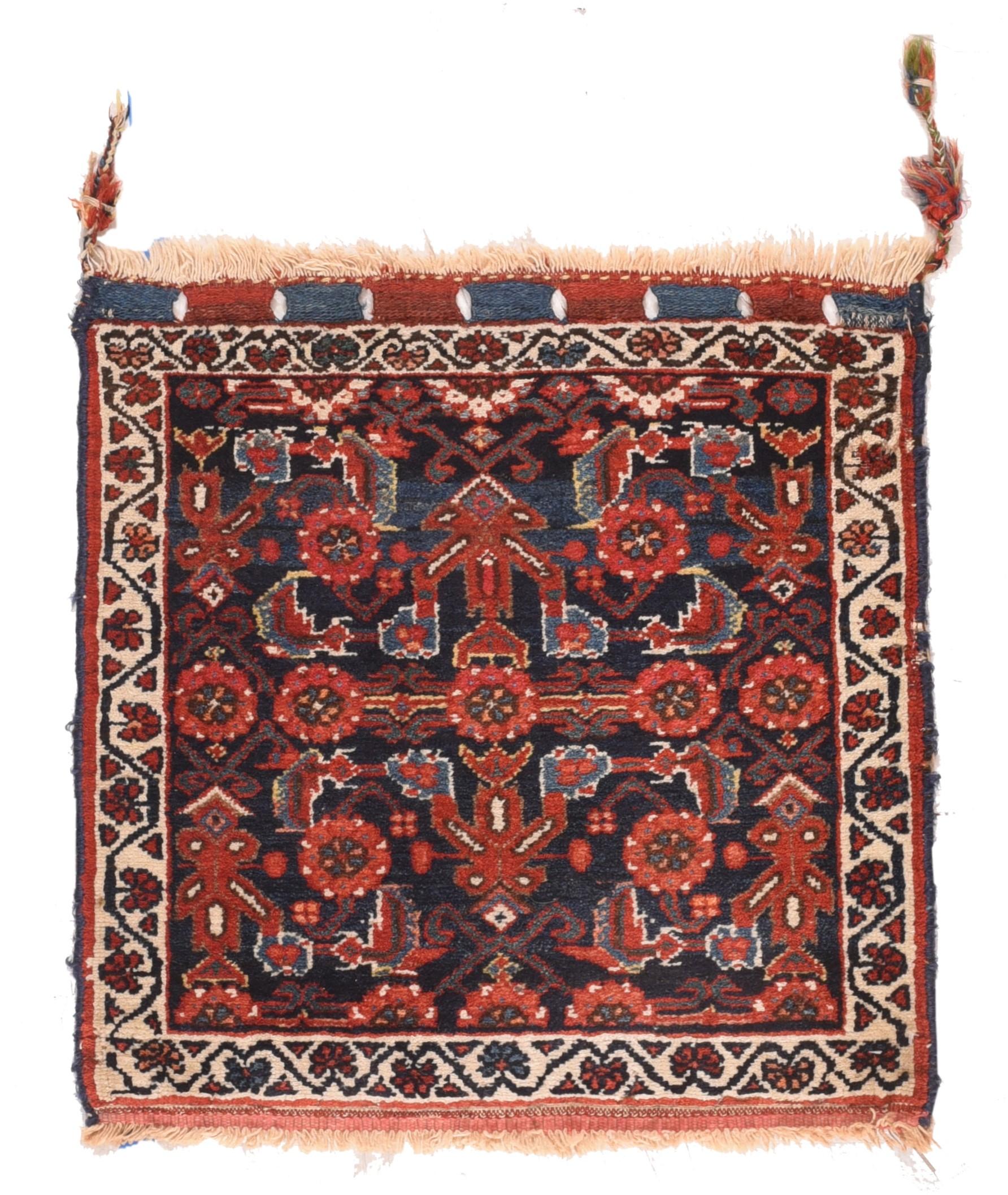 Antique Afshar rug. Measures: 1'11'' x 2'2''. This attractive nomadic artefact shows a navy ground filled by a single Herati motif detailed in red, light-medium blue, ecru, rust-red and dark green .Ecru border of reversing fan palmettes on stalks.