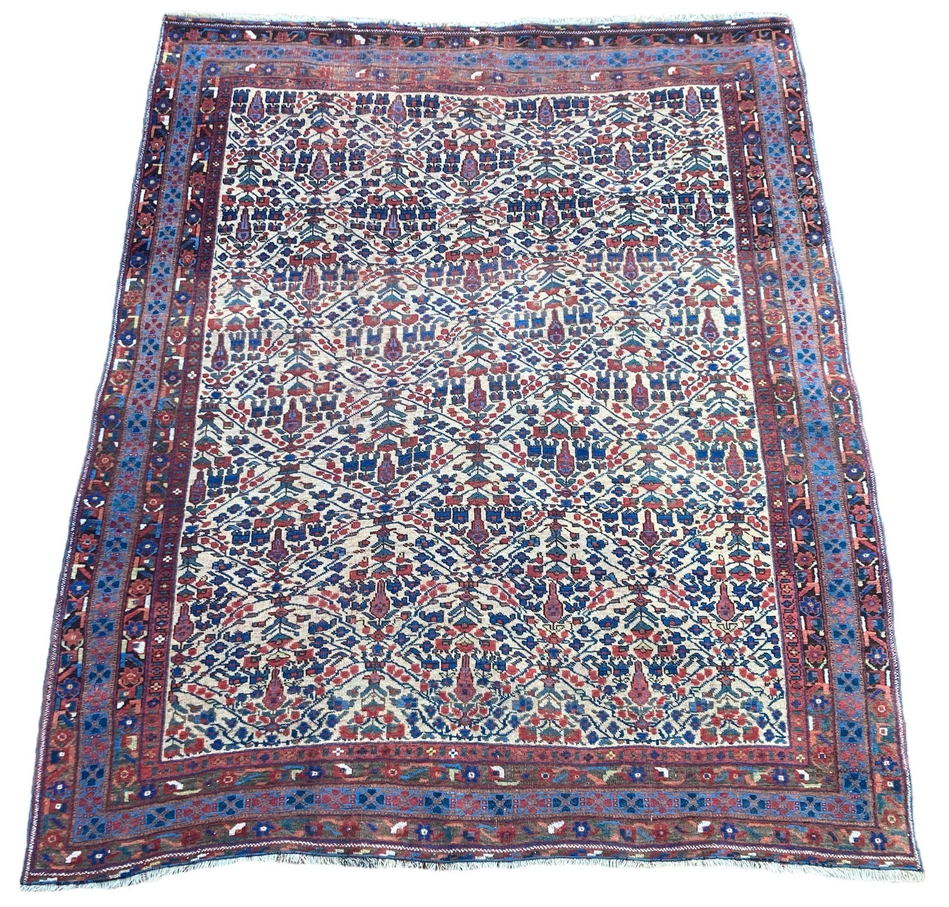A beautiful antique Afshar rug, handwoven circa 1900 with an all over geometrical design of shrubs and flowers on an ivory field and light indigo border. A great example of tribal weaving and a very decorative rug.
Size: 1.90m x 1.56m (6ft 3in x 5ft
