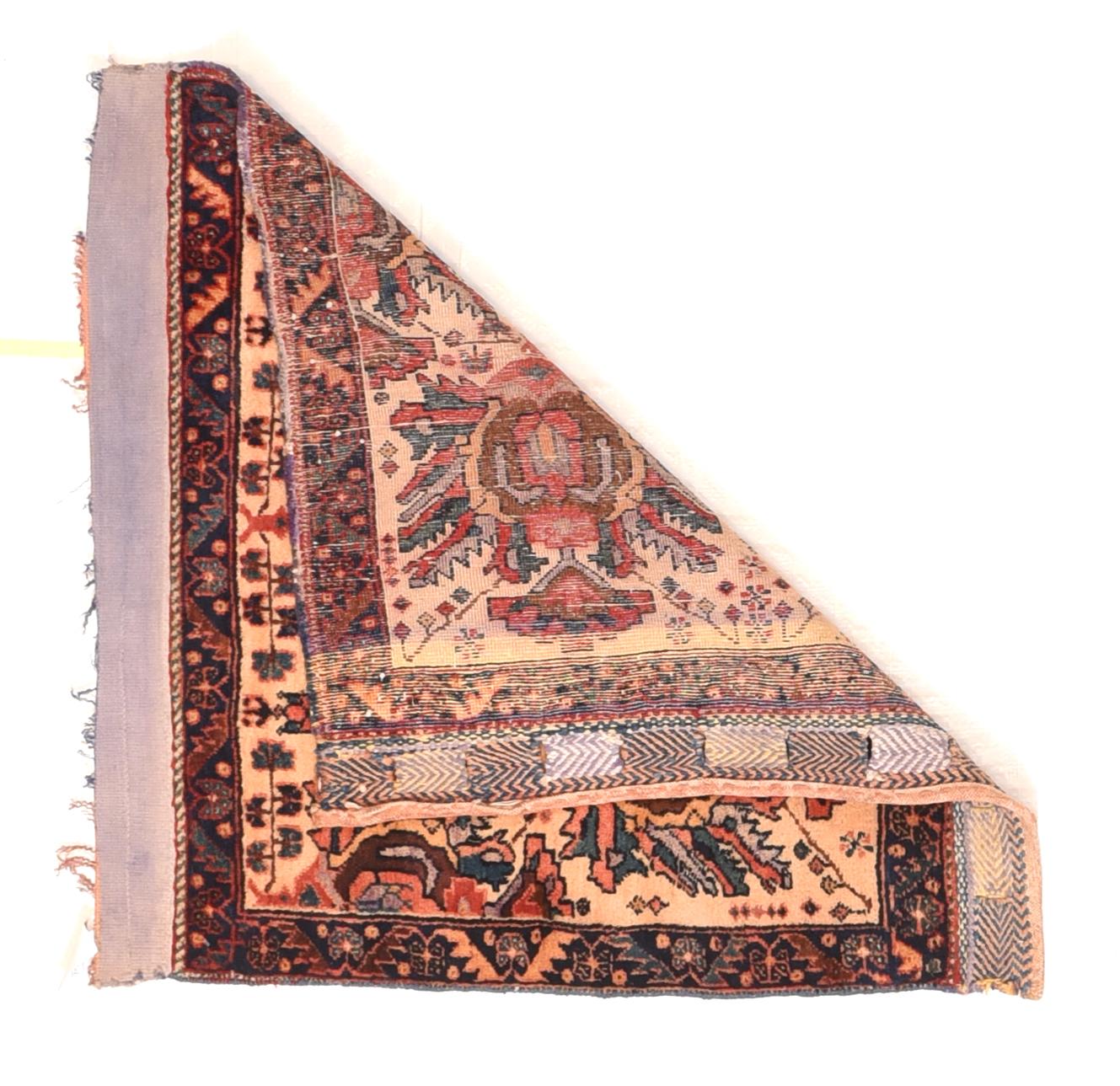 Antique Afshar Rug 2'2'' x 2'2''. Saddlebags are always made in pairs and this attractive, boldly patterned piece shows two rows of giant ragged petal palmettes within a navy serrated leaf and reversing fan palmette border. with intact