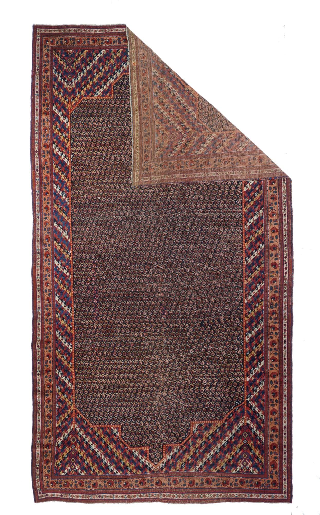 This large Rafasanjani subtribal piece  shows a navy cartouche-shaped sub-field tightly displaying hundreds  of tiny, one-way botehs.  Surrounding field patterned with  diagonal colour bars in straw, cream,  red, ecru and royal blue. Characteristic