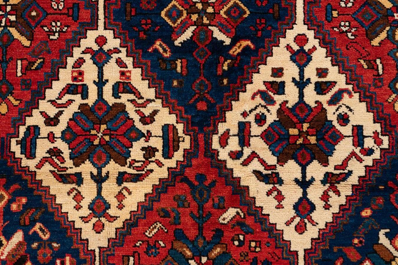 Afshar - Southern Persia

This large Afshar is a rug that transmits exuberant joy. It has an ivory field with rows of medallions in colourful diamonds containing flowers and geometric figures. The central area is protected by six borders with blue