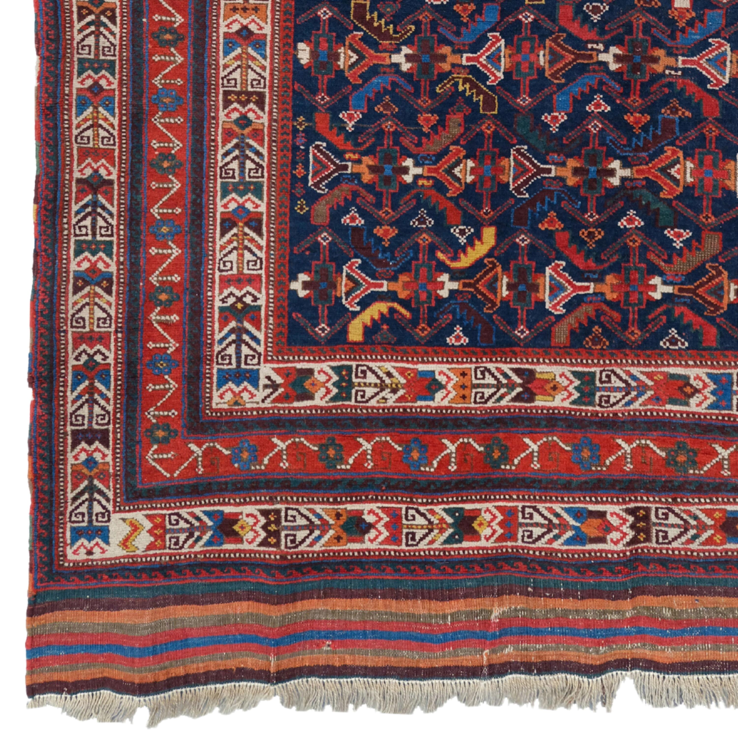 Antique Afshar Rug  Antique Rug

An good tribal Afshar rug with a repeat herati (leaf) design on a dark indigo blue ground. The herati design is drawn in bands across the rug which is quite an unusual feature. Note the long kilim ends with a banded