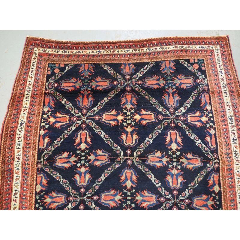 Woven Antique Afshar Tribal Rug with Lattice and Flowering Tulip Design For Sale
