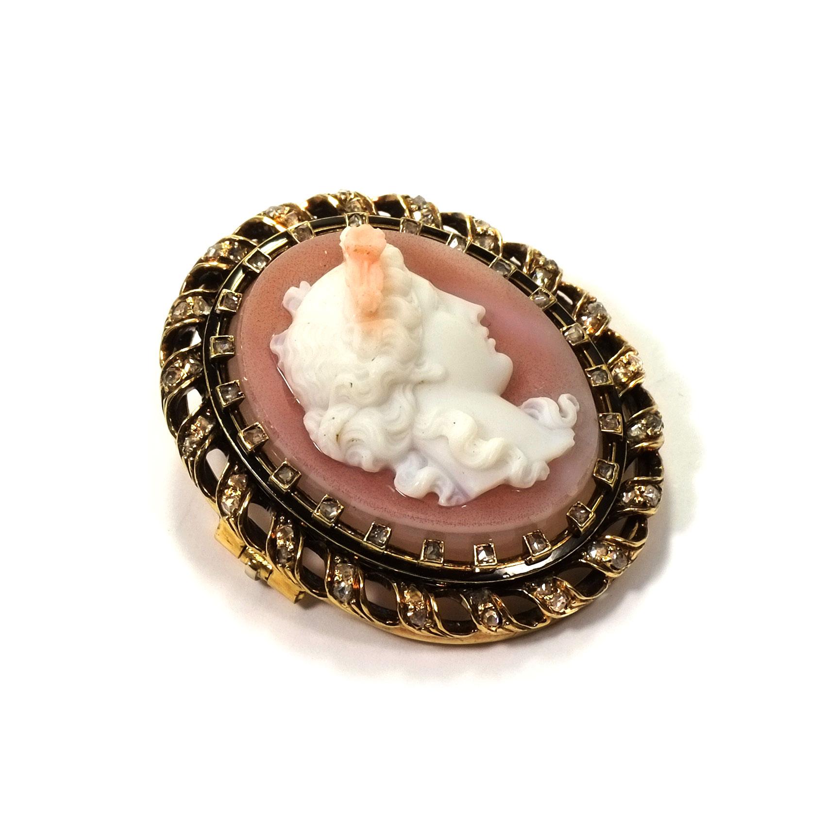 French antique Agate cameo diamond and enamel gold Brooch circa 1870

This brooch set with a finely carved rose-colored Agate cameo depicting the roman goddess Flora, surrounded by a garland of rose cut diamonds in an elaborately worked gold frame,