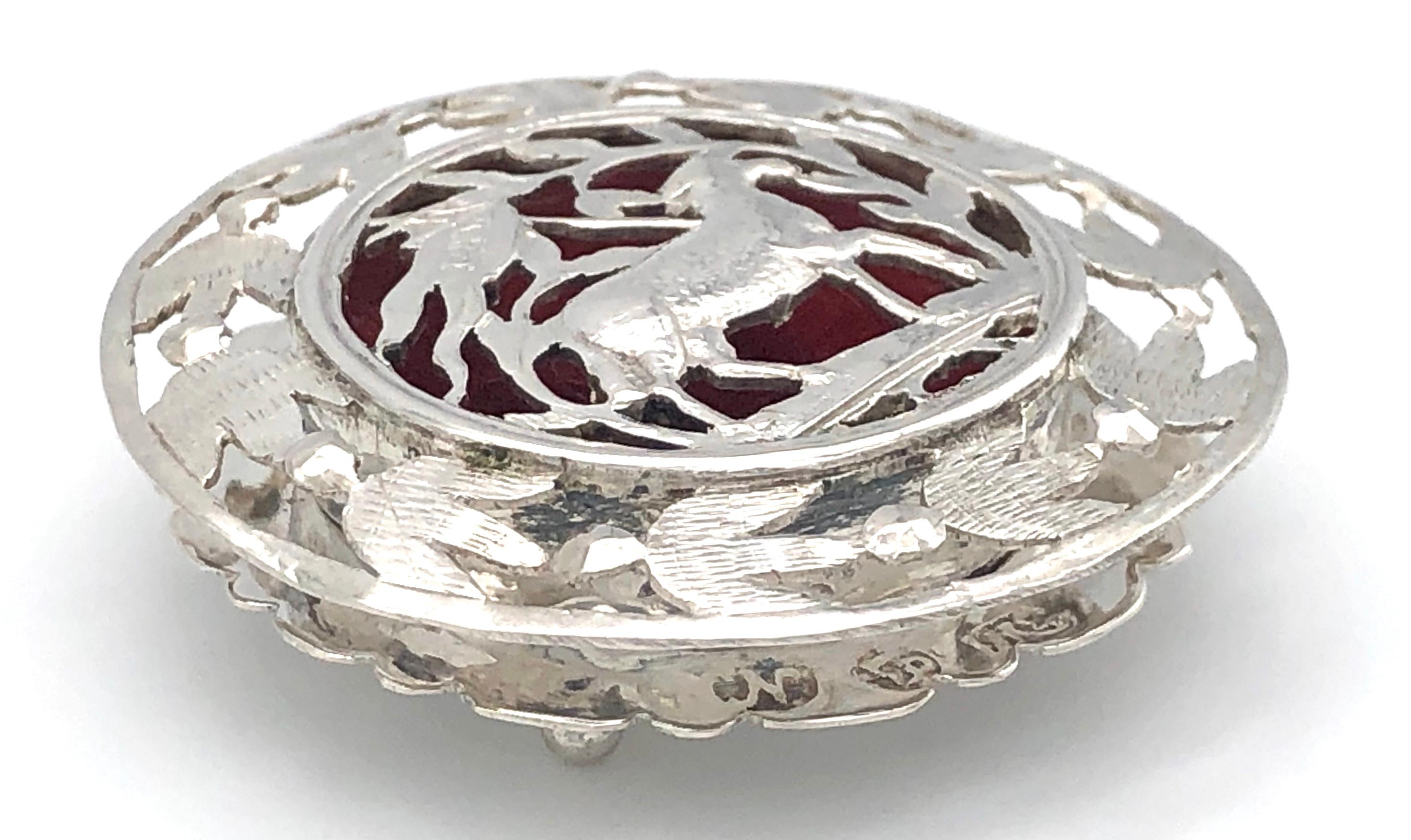 Charming sliver open work box  for hosts. The outer rim of the round lid features doves of peace. In the center there is the lamb of godwith the flag of victory. 