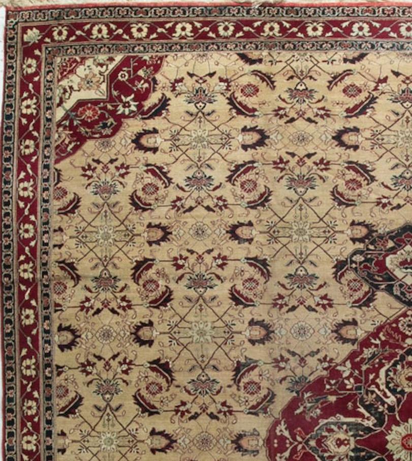 This squarish extraordinarily beautiful rug has a wonderful ivory field complimented with traditional Agra reds that creates a true masterpiece of design and style. Agra rugs in this size are extremely difficult to find and give this piece a special