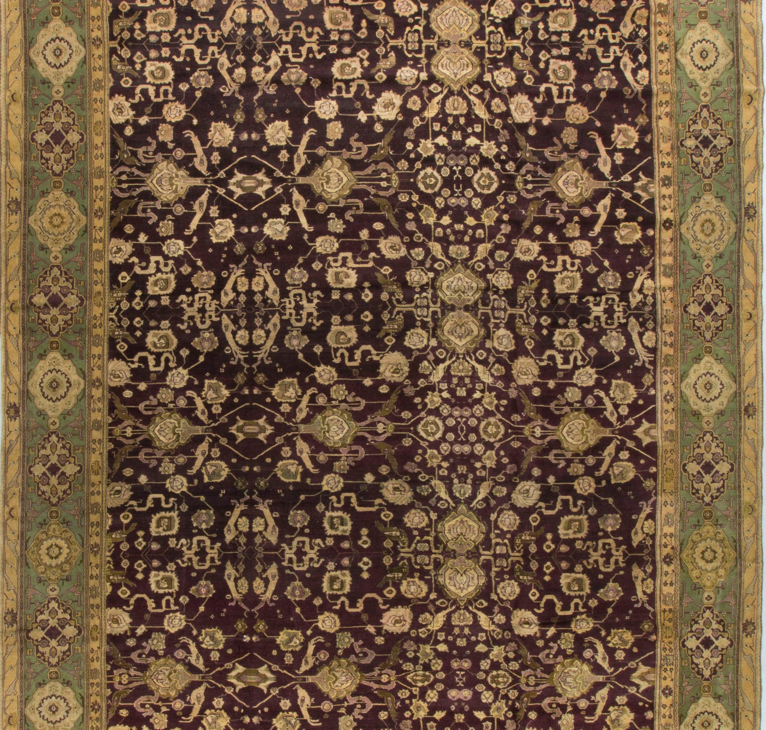 This rug has all the attributes of an Agra rug from this time period. The deep red colors, known as Agra Red, the border colors and the designs go to create a style that has maintained its popularity and which makes these genuine pieces so hard to