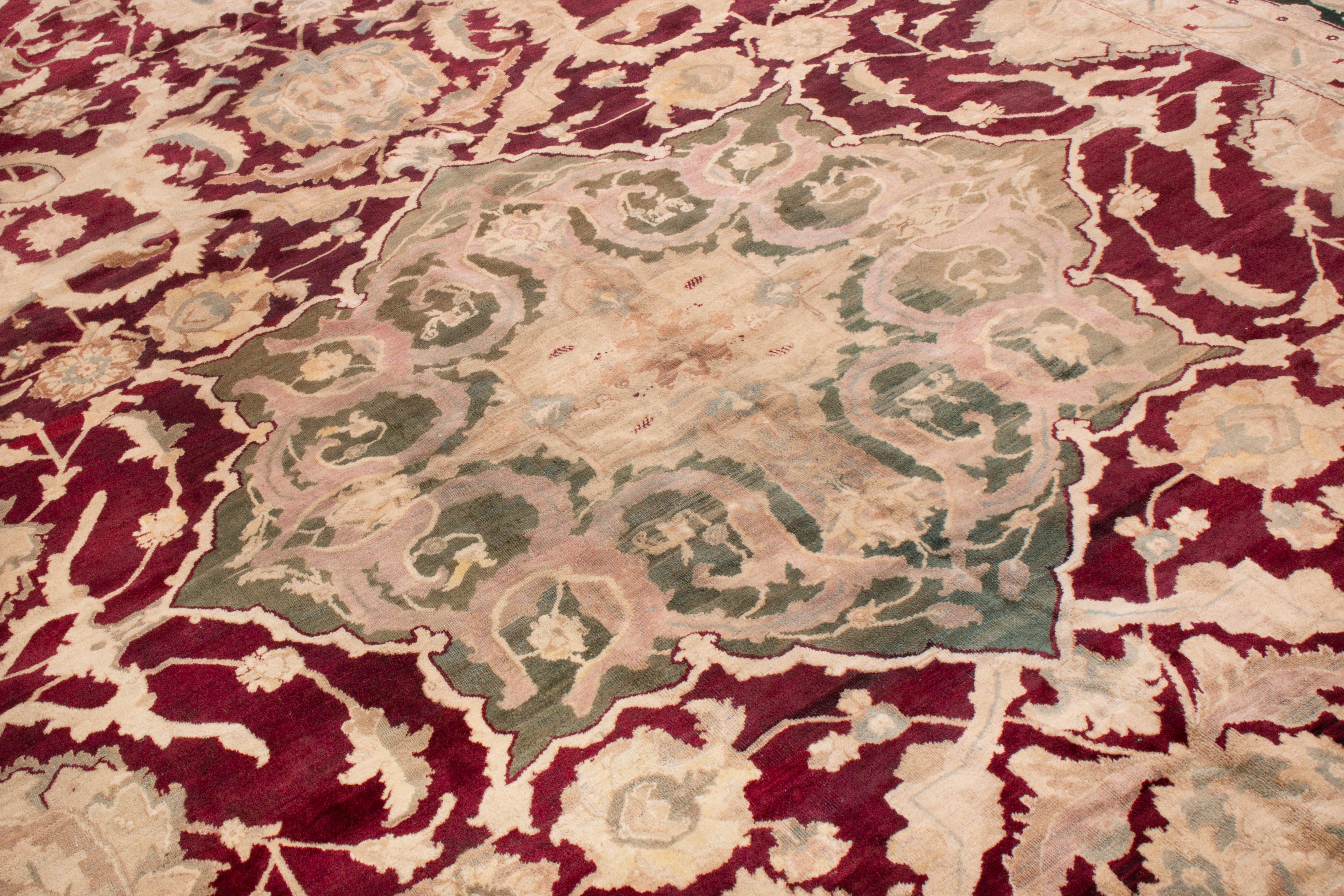 Indian Antique Agra Burgundy Wool Rug with All-Over Floral Patterns For Sale