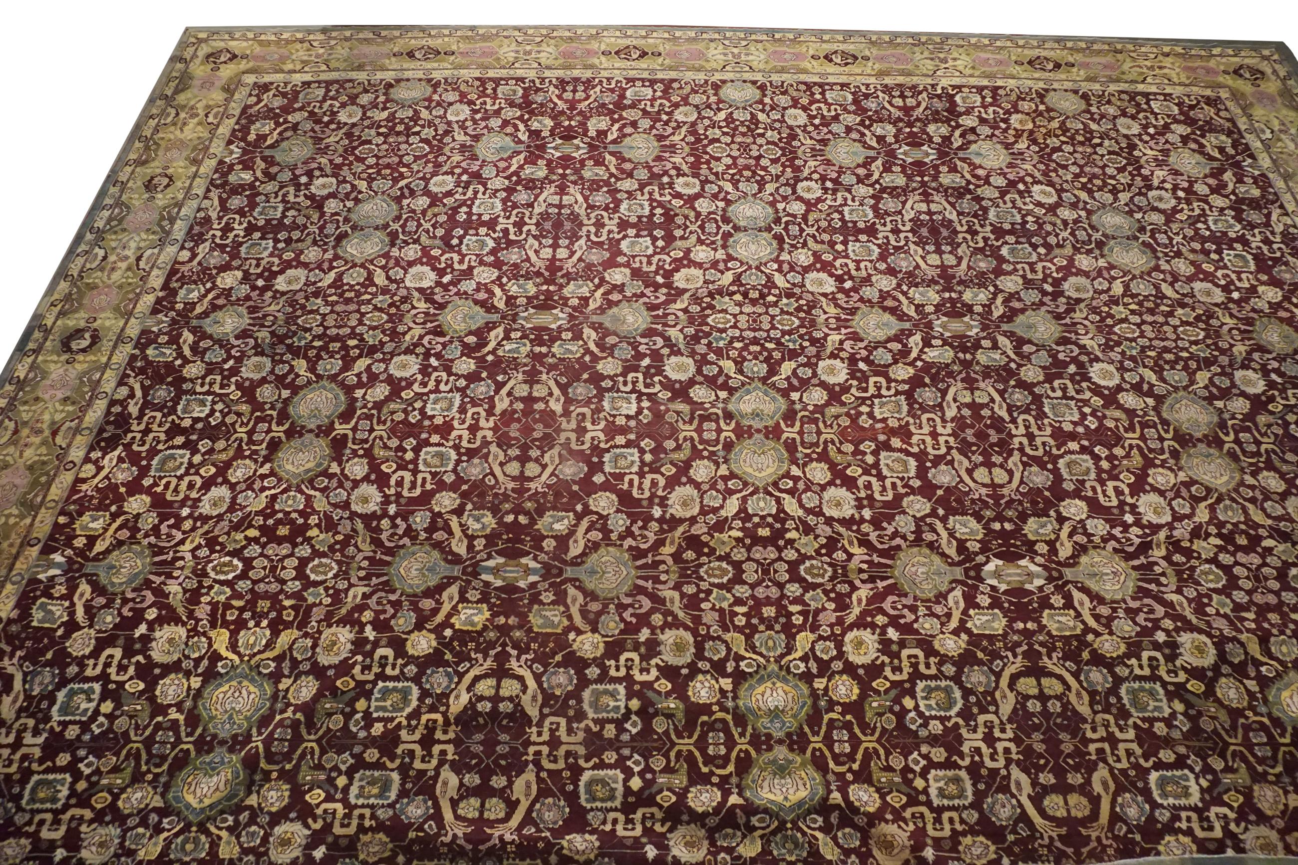 Hand-knotted wool pile on a cotton foundation.

Bird and Snake Design

circa 1890

Dimensions: 23' x 26'

Origin: India 

Condition: excellent for its age

Field color: Burgundy

Border color: yellow-green

Accent color: light-blue,