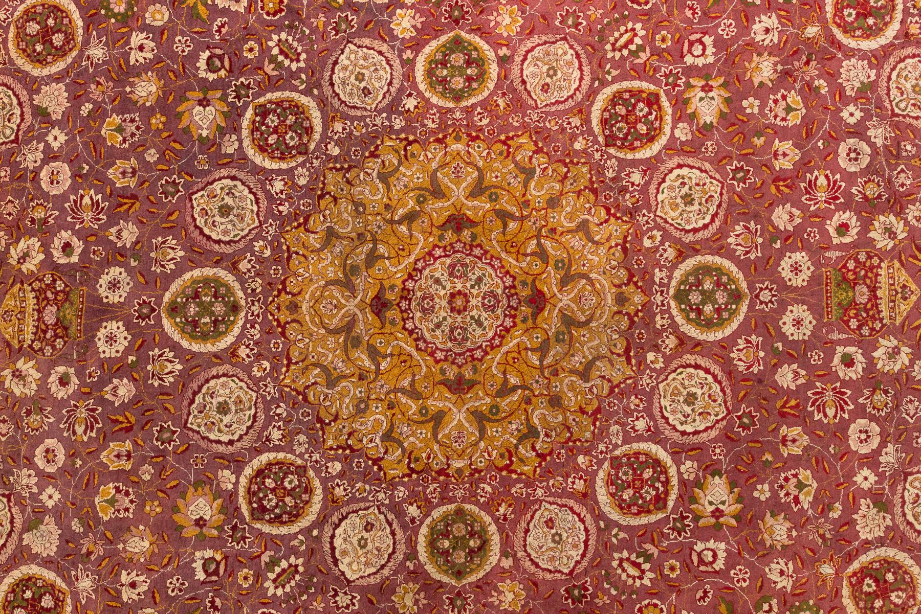 Agra - North India

This is a 120-year-old monumental Agra rug in excellent condition. This piece was inspired by the famous Persian rug, Ardabil, made in the 16th Century for the Persian court. The main field of the rug is woven in marsala. Sixteen