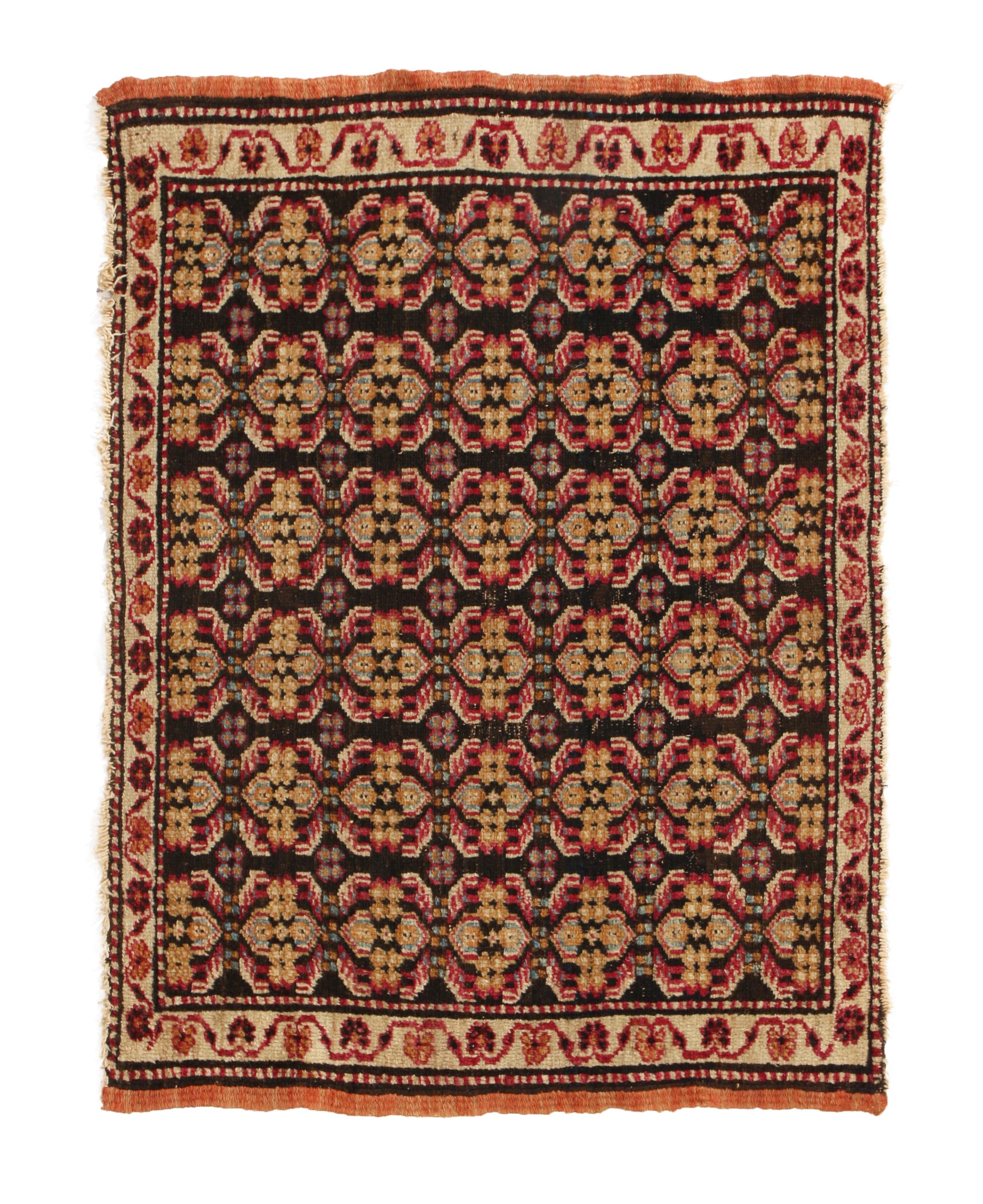 Hailing from India between 1890-1900, this hypnotic antique Agra rug is hand knotted in high quality wool with a hypnotic departure from traditional designs in its field. Emboldened by an partisan pairing of beige and red colorways against black