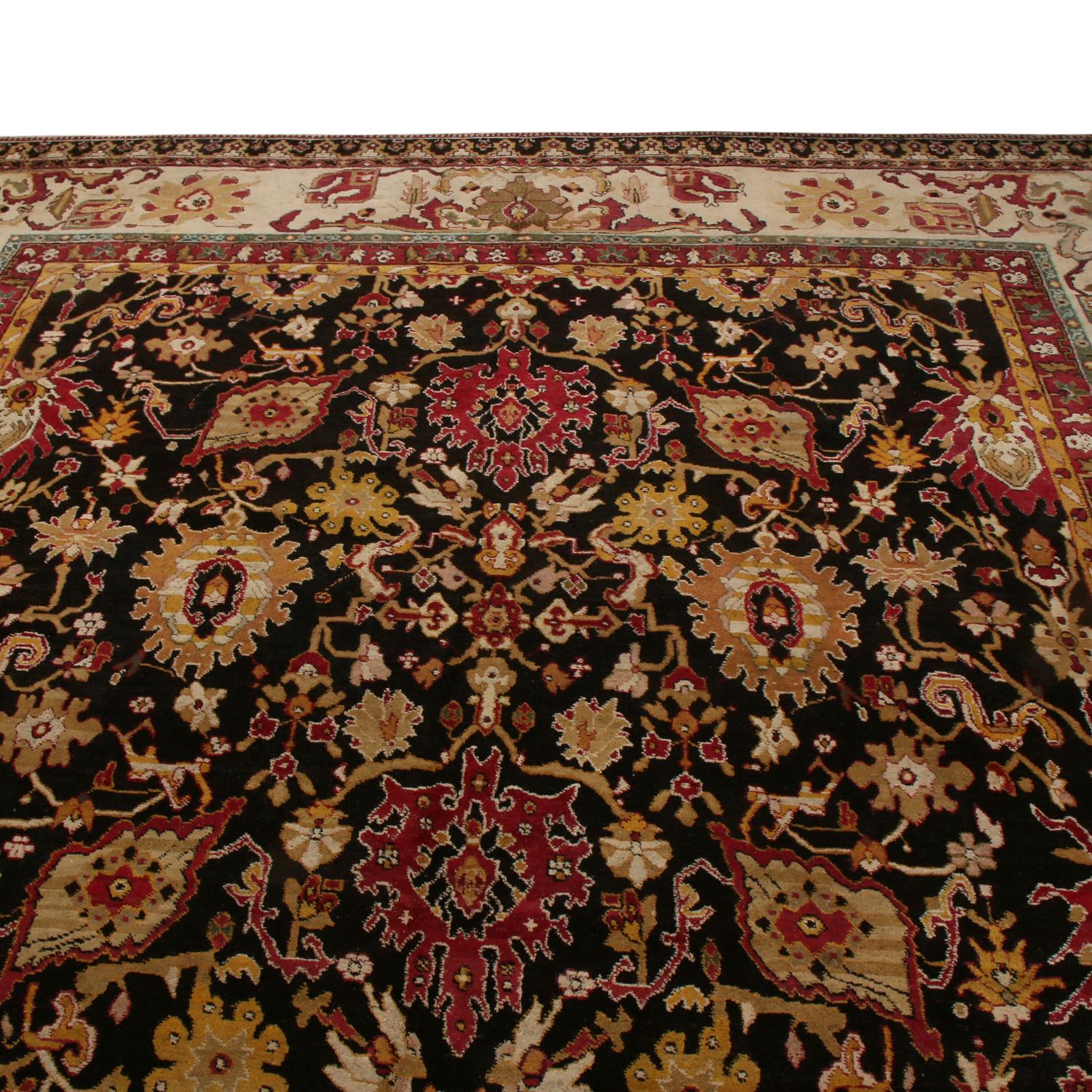 Originating from India between 1880-1890, this hand knotted antique Agra wool rug hosts an uncommon background of subtly abrashed earth tones, elegantly lifting the more regal hues of gold and red throughout a finely drawn all-over field design.
 